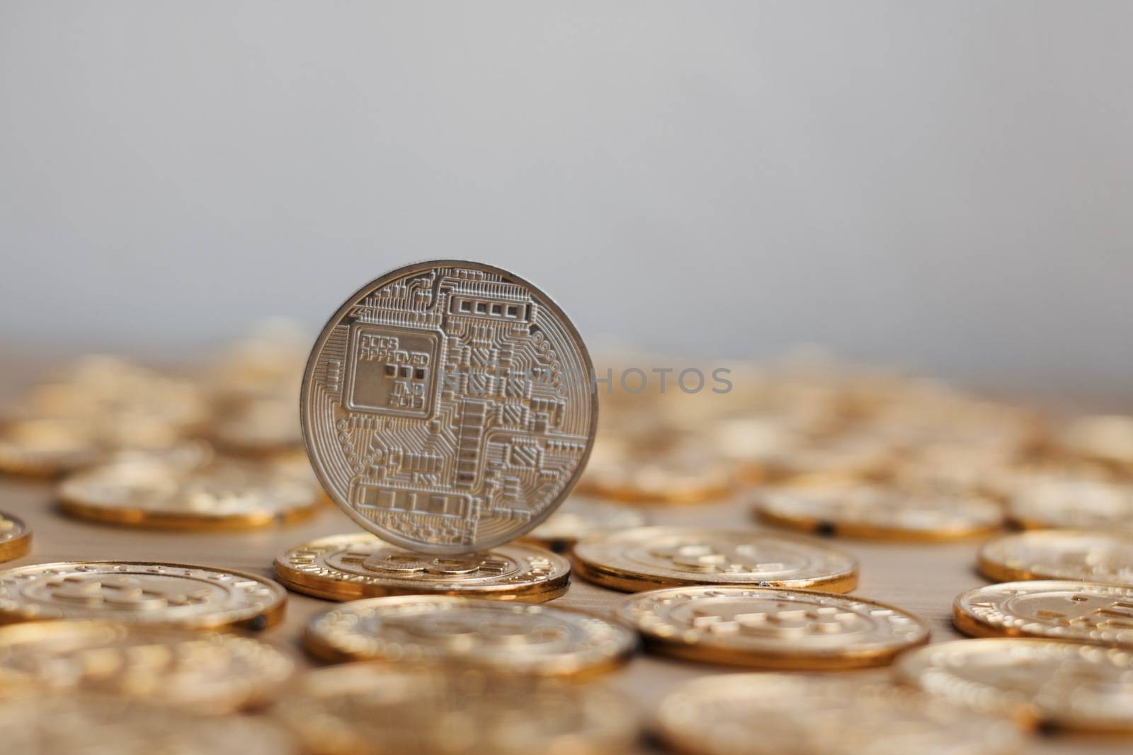 Digital currency physical bitcoin coin. Gold background coins concept.