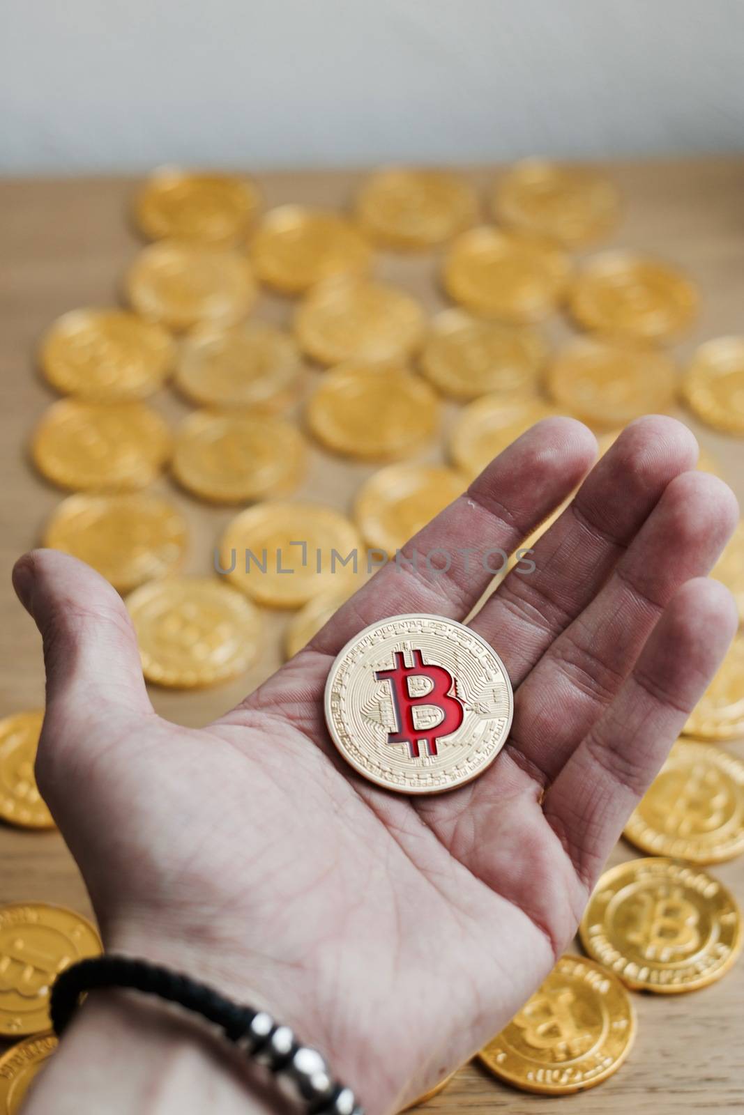 Digital currency physical bitcoin coin. Gold background coins concept.