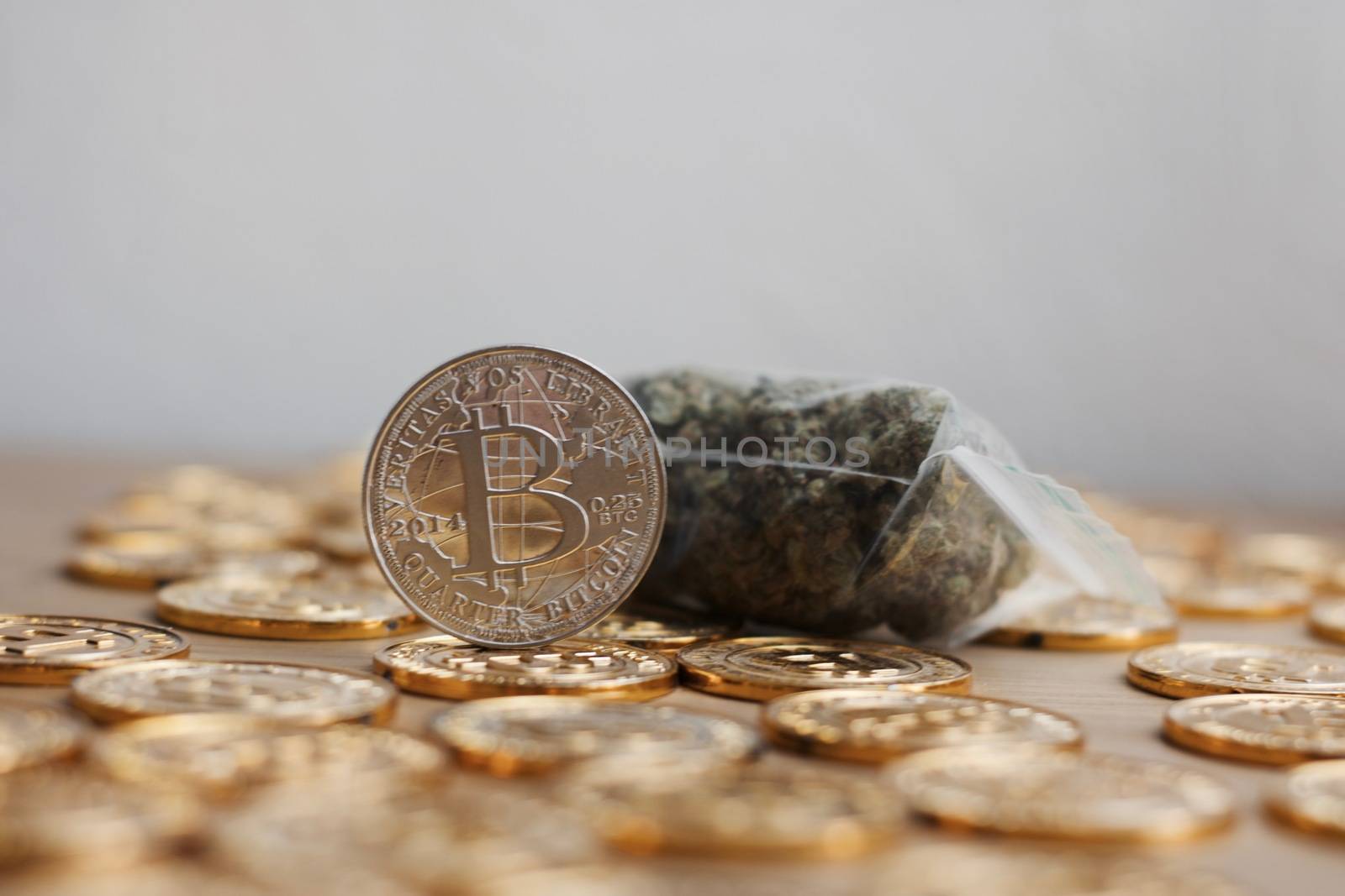 Digital currency physical bitcoin coin. Gold background coins concept.