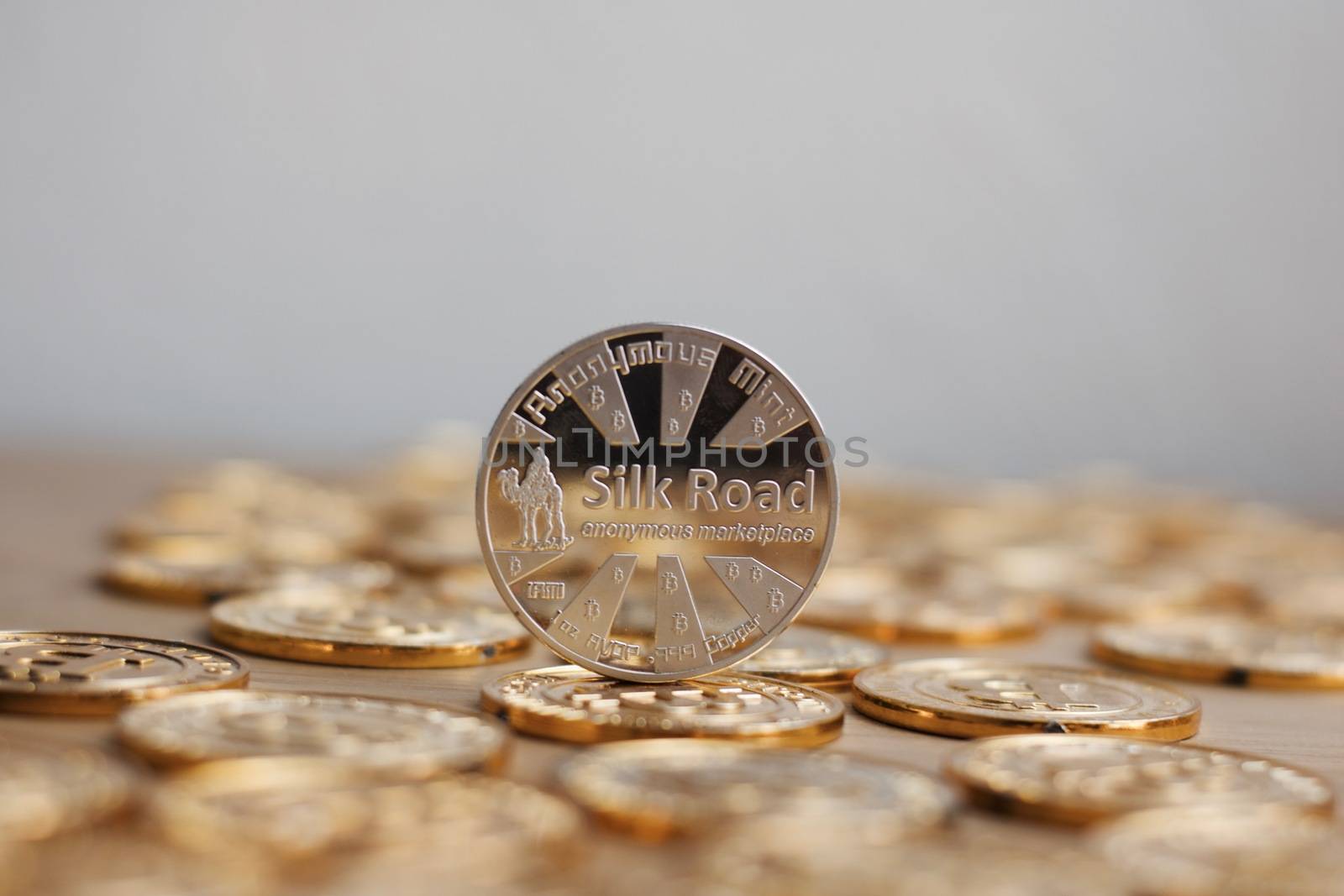 Digital currency physical bitcoin coin. Gold background coins concept.