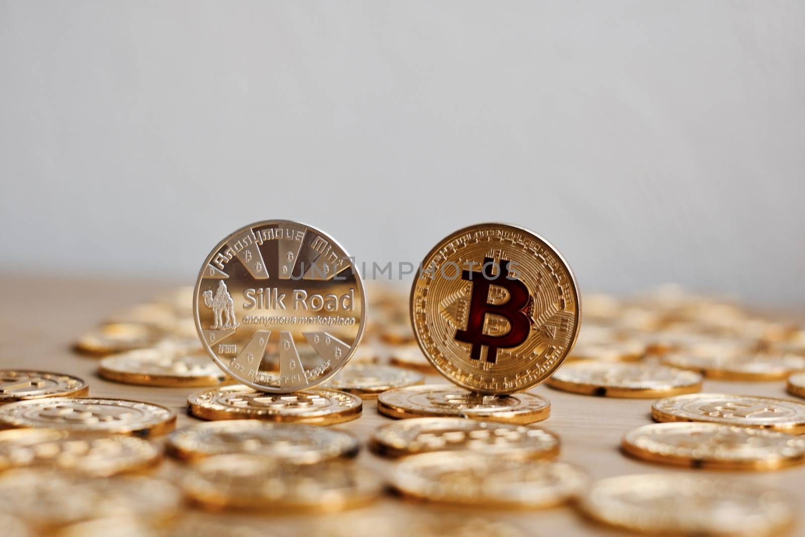 Digital currency physical bitcoin coin. Gold background coins concept.