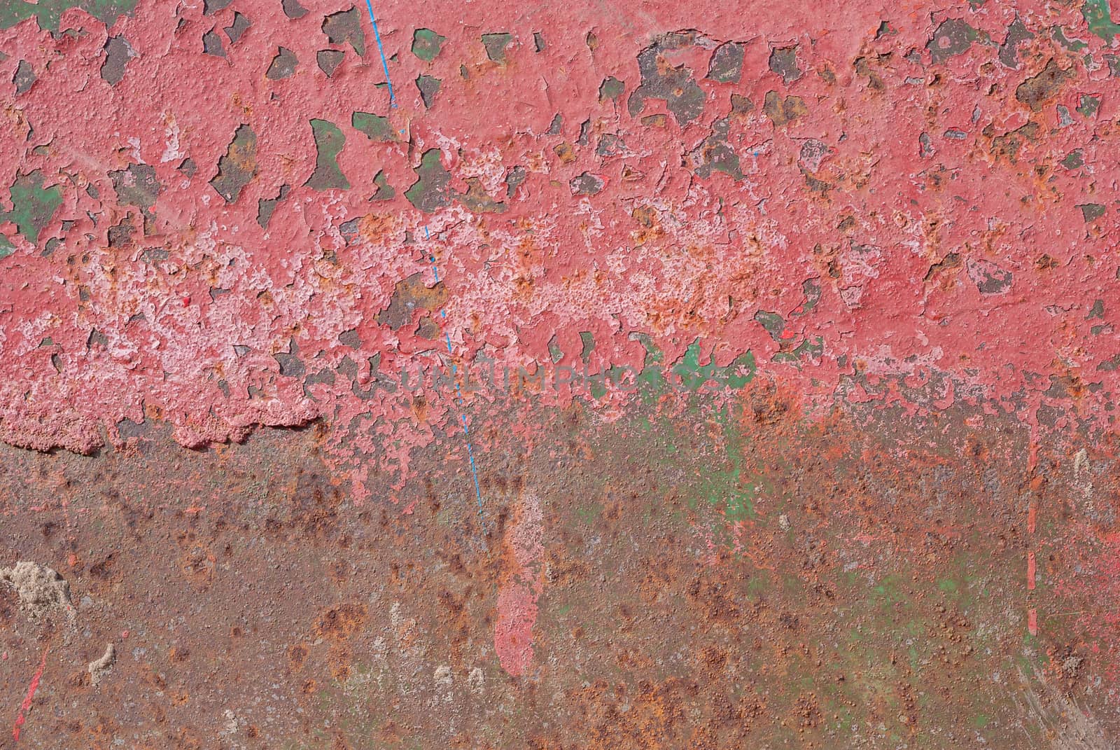 surface of rusty iron with remnants of old paint, red texture, background by uvisni