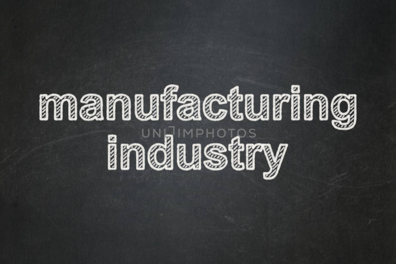 Industry concept: text Manufacturing Industry on Black chalkboard background