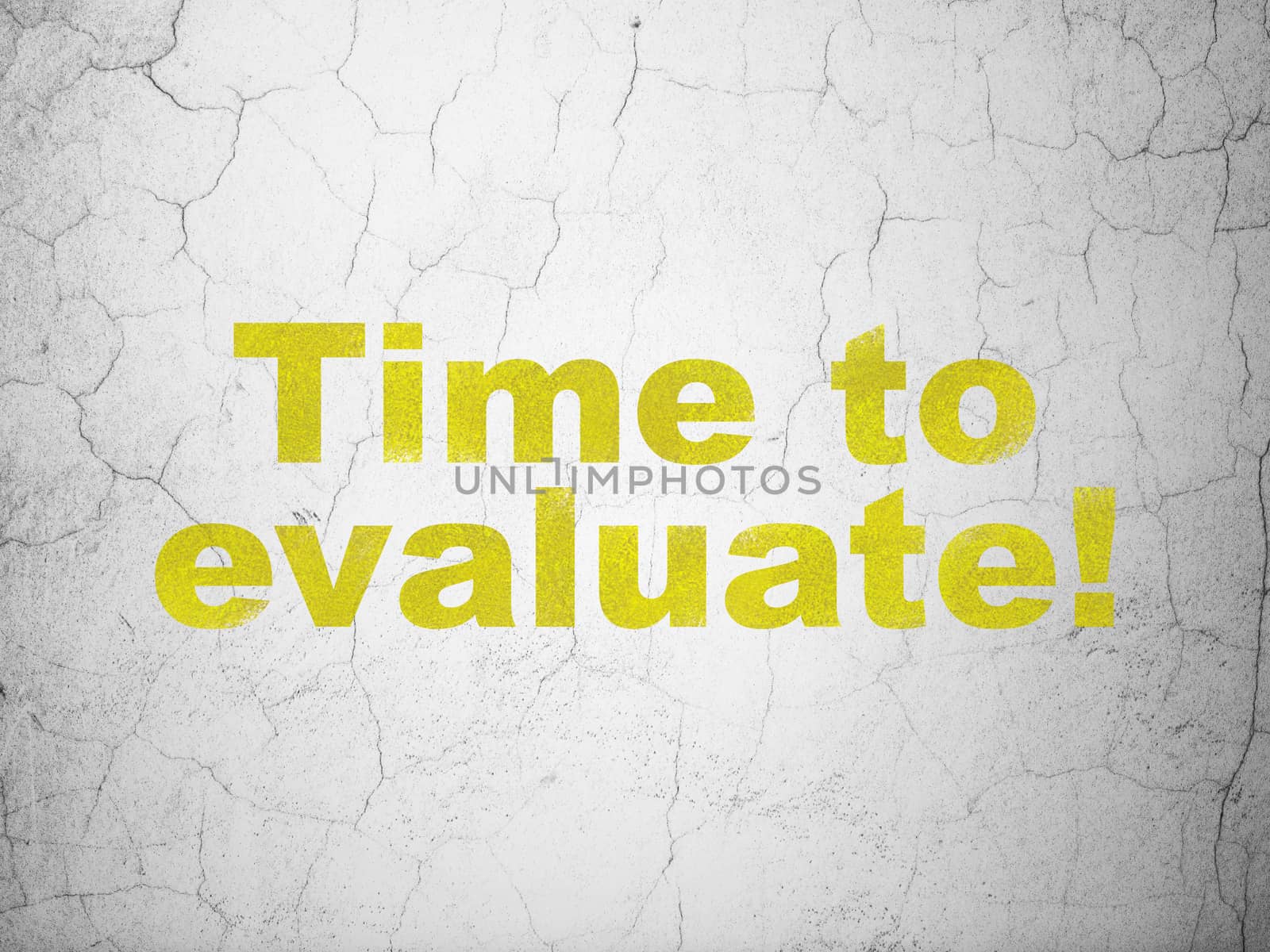 Time concept: Yellow Time to Evaluate! on textured concrete wall background