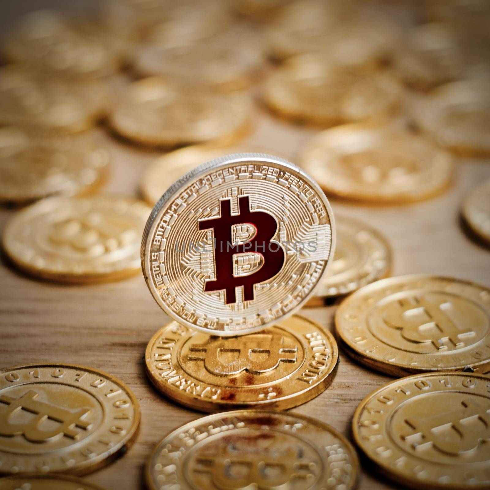 Digital currency physical bitcoin coin. Gold background coins concept.