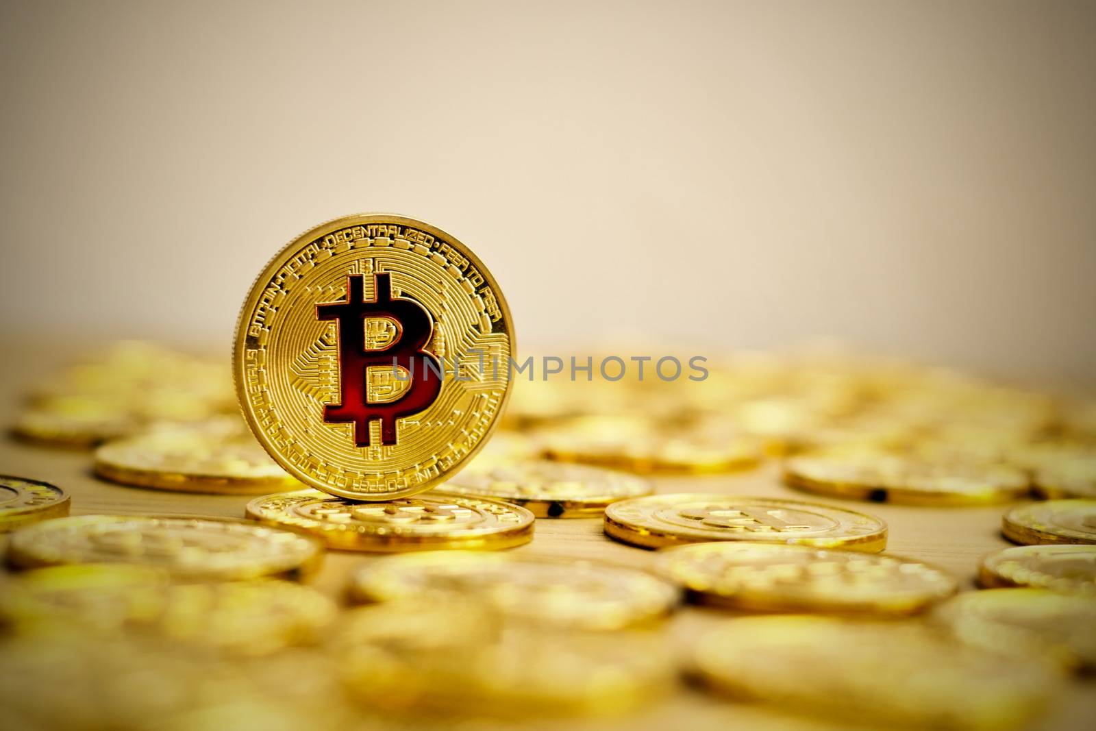 Digital currency physical bitcoin coin. Gold background coins concept.