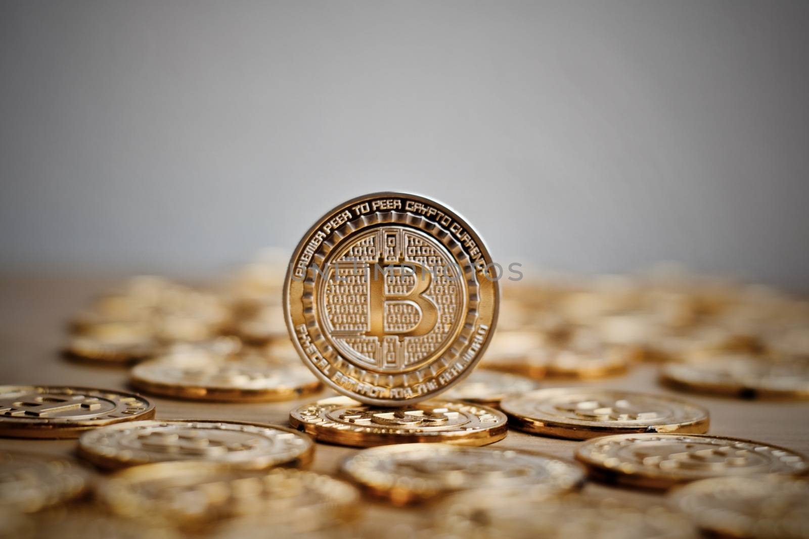 Digital currency physical bitcoin coin. Gold background coins concept.