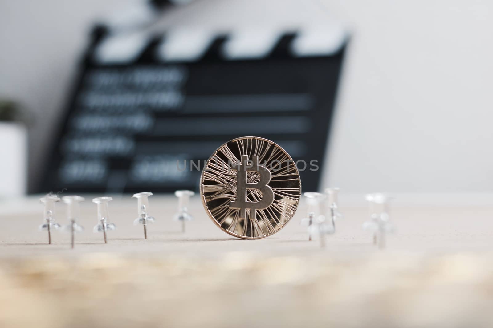 Digital currency physical metal bitcoin coin. Cryptocurrency cinema concept.