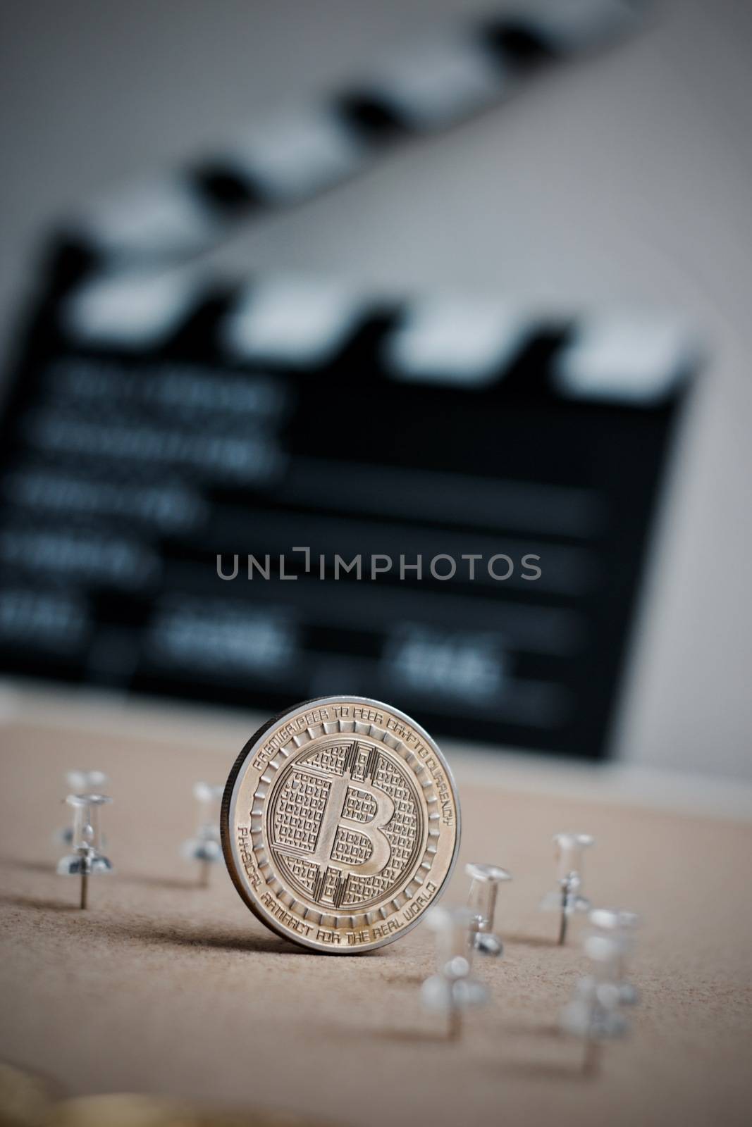 Digital currency physical metal bitcoin coin. Cryptocurrency cinema concept.