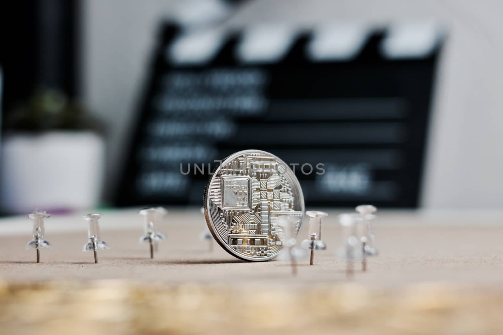 Digital currency physical metal bitcoin coin. Cryptocurrency cinema concept.