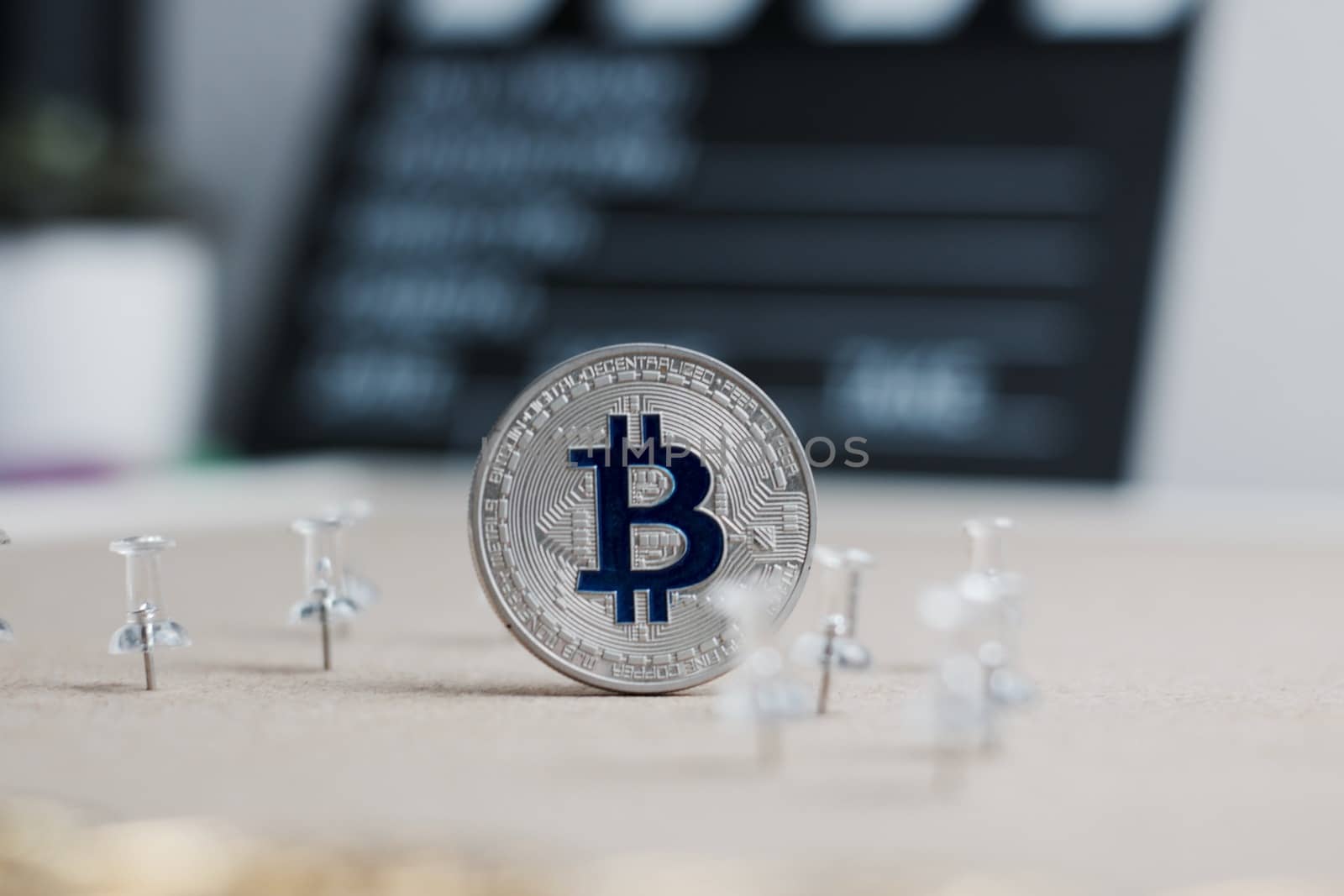 Digital currency physical metal bitcoin coin. Cryptocurrency cinema concept.