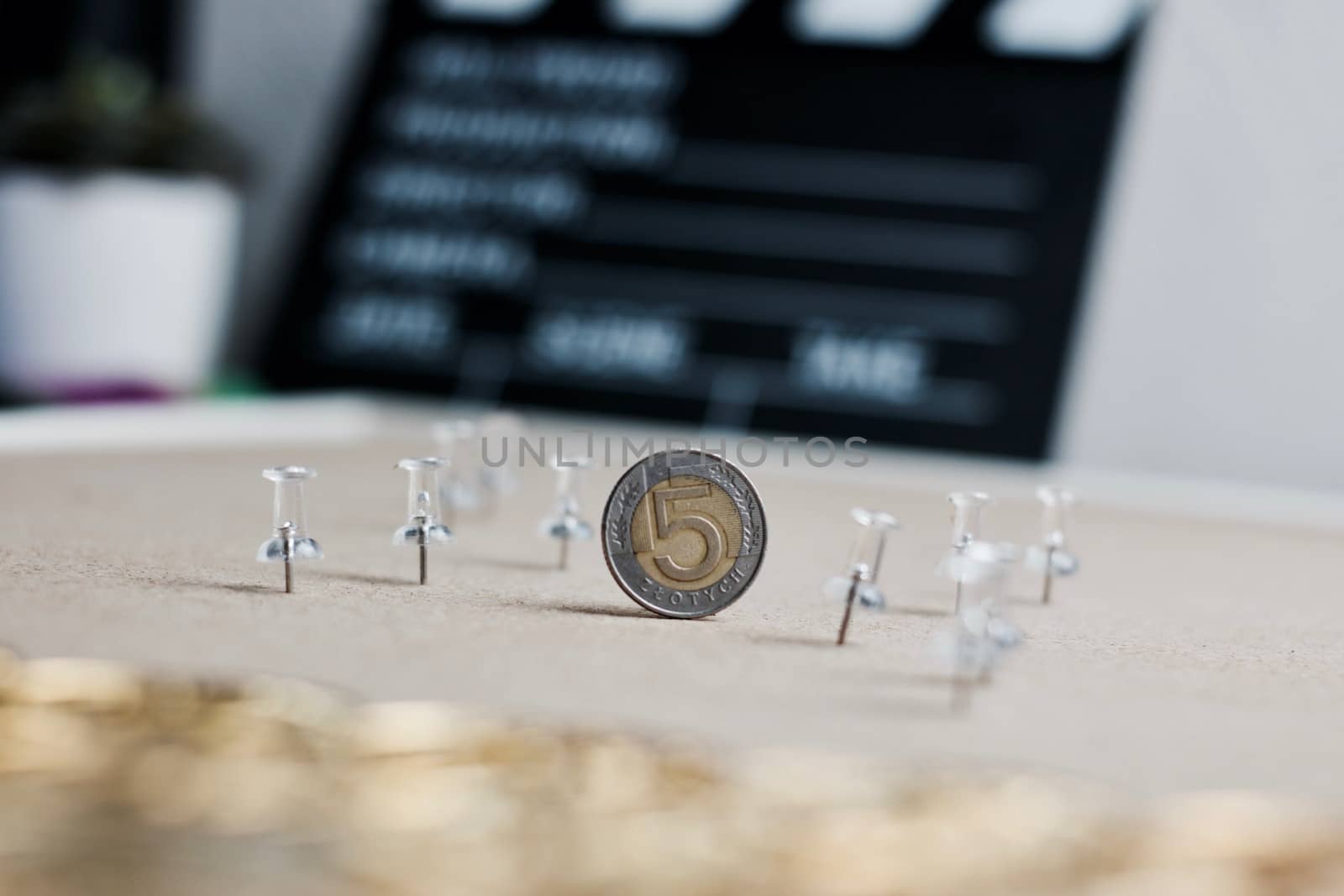 Physical polish coin near cinema board. Polish money lifestyle concept.