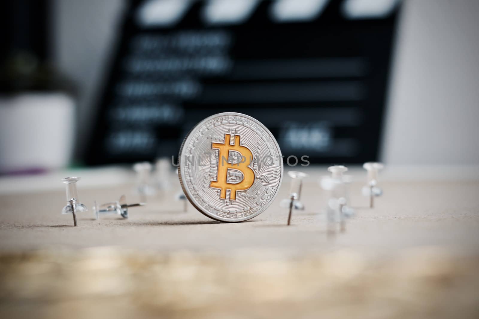 Digital currency physical metal bitcoin coin. Cryptocurrency cinema concept.