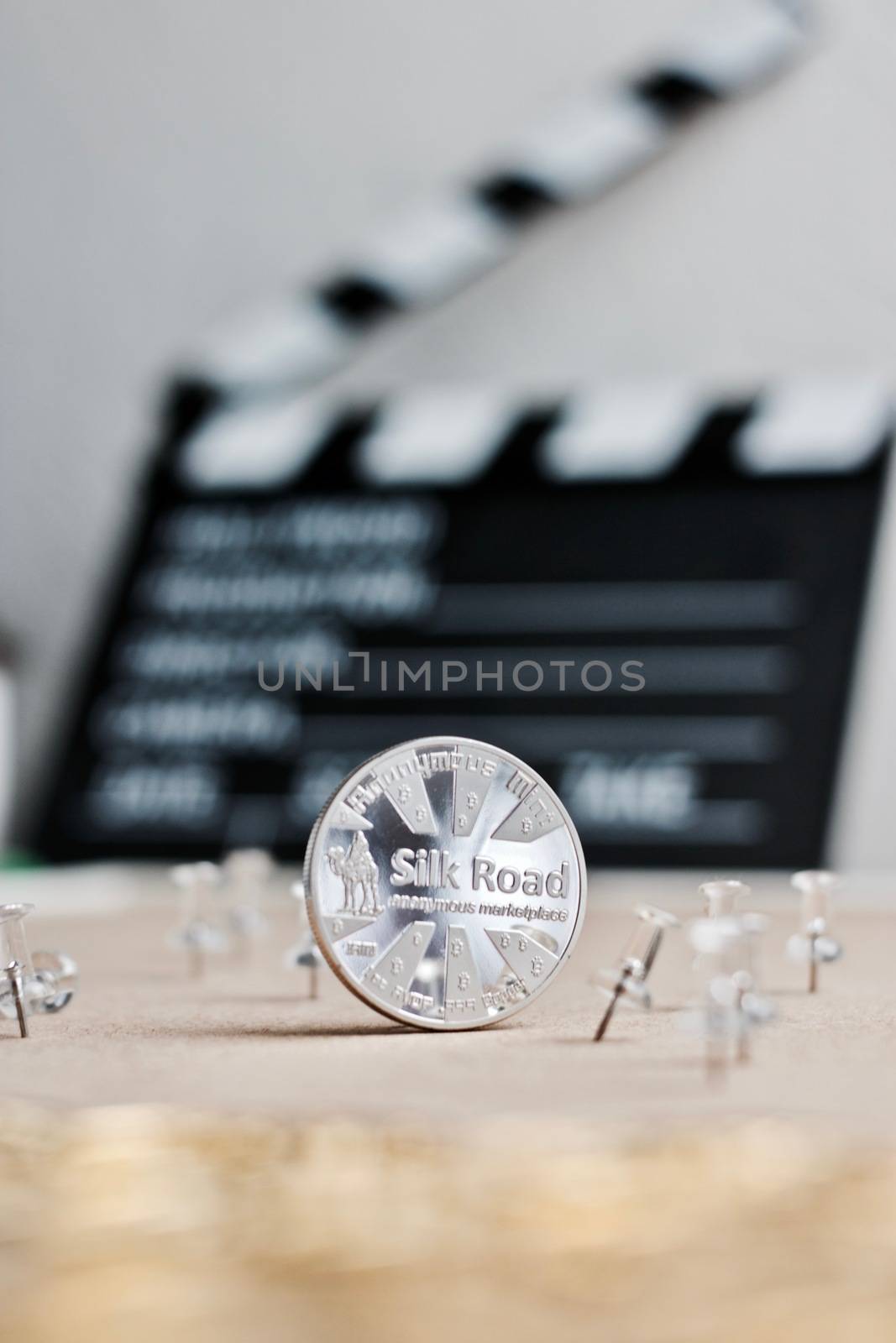 Digital currency physical metal bitcoin coin. Cryptocurrency cinema concept.
