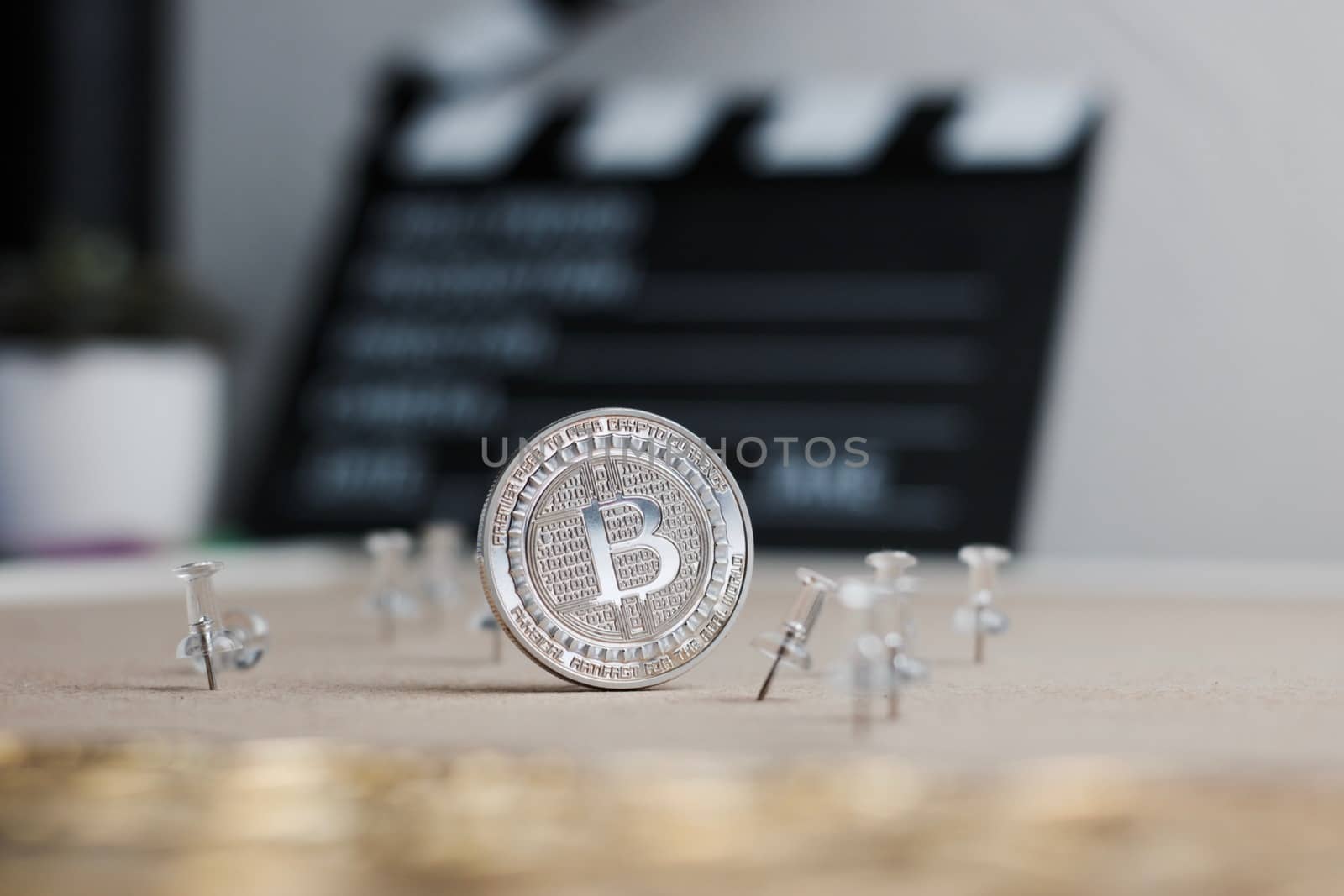 Digital currency physical metal bitcoin coin. Cryptocurrency cinema concept.