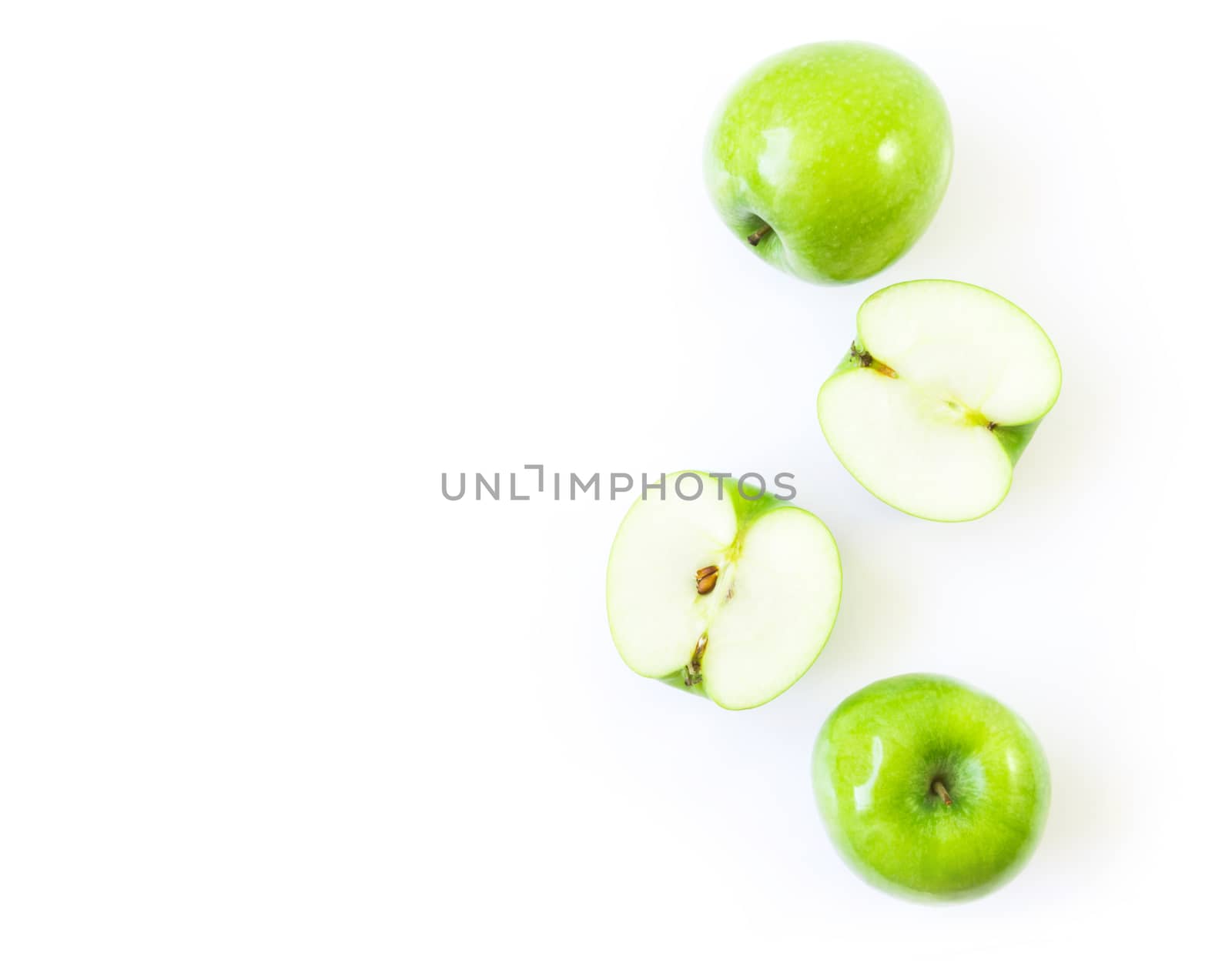 Closeup top view green apple on white background with space for product or text advertising, fruit healthy concept