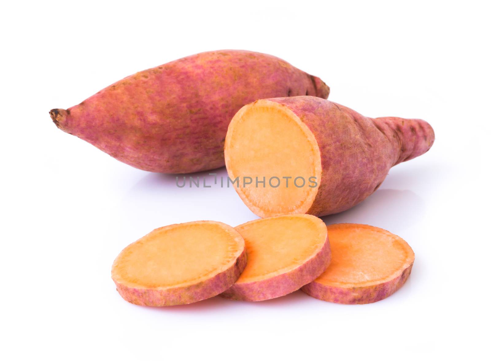 Sweet potato with slices on white background, raw food