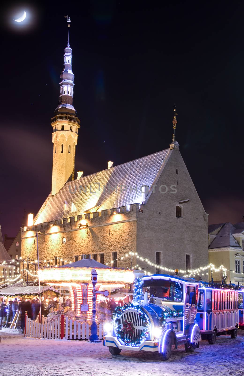 Christmas market and christmas train near city hall in old city of Tallinn, Estonia