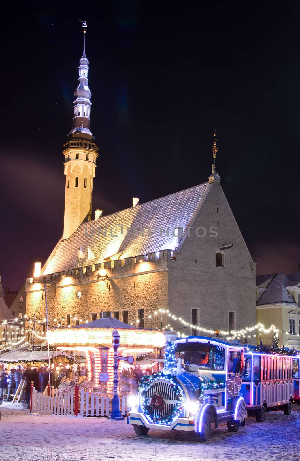 Christmas market and christmas train near city hall in old city of Tallinn, Estonia