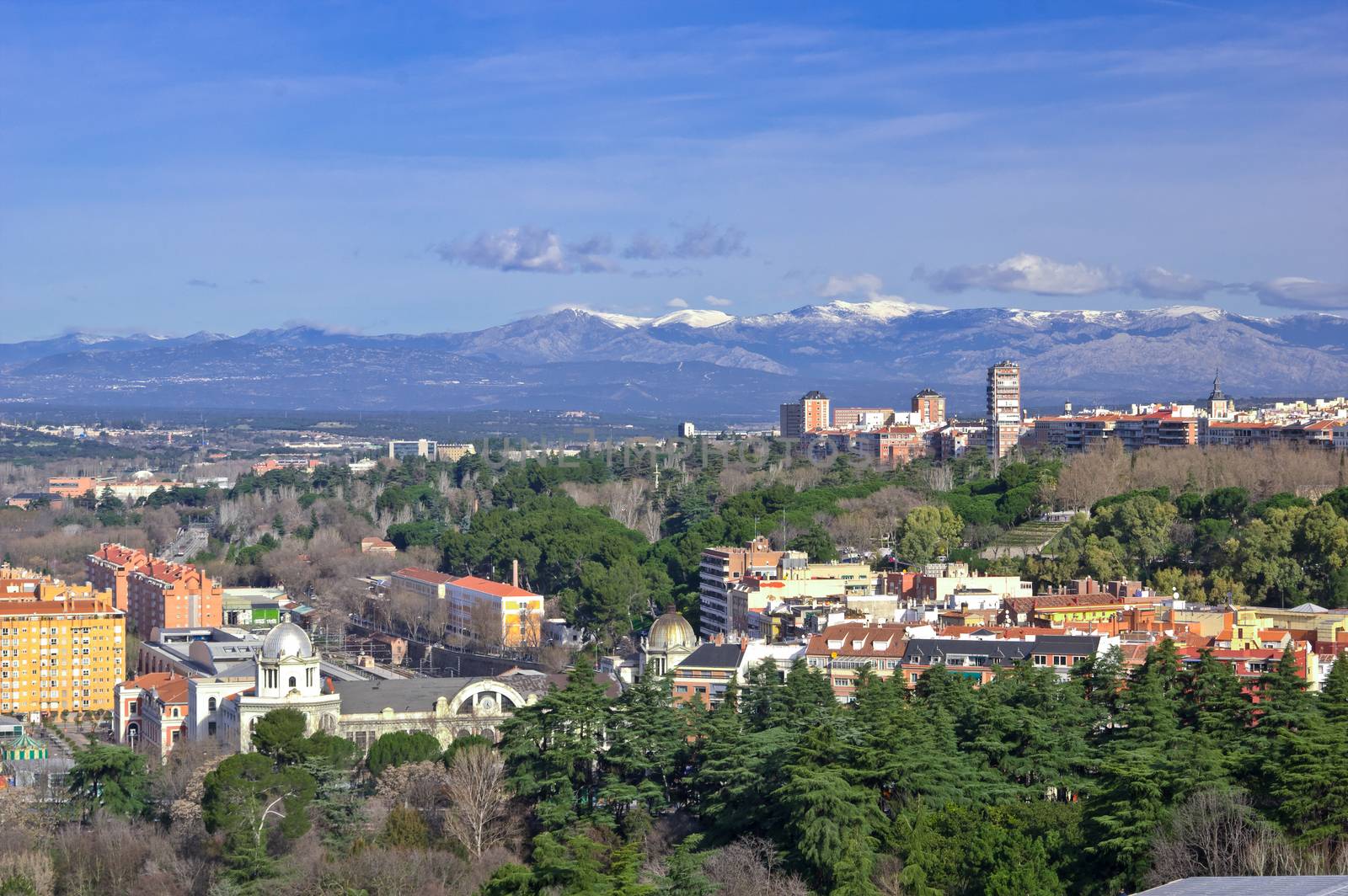 Aerial view of Madrid with Guadarrama Mountains (Sierra de Guadarrama) on background, Spain