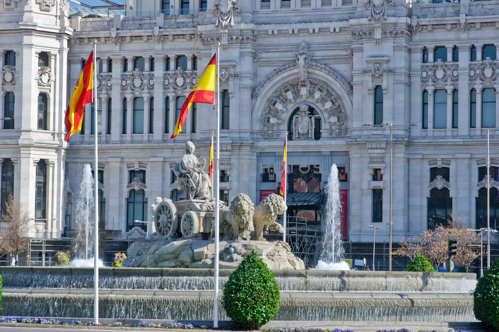 Fountain on Cybele Square (Plaza de Cibeles) with Cybele Palace (Palacio de Cibeles) on background in Madrid, Spain