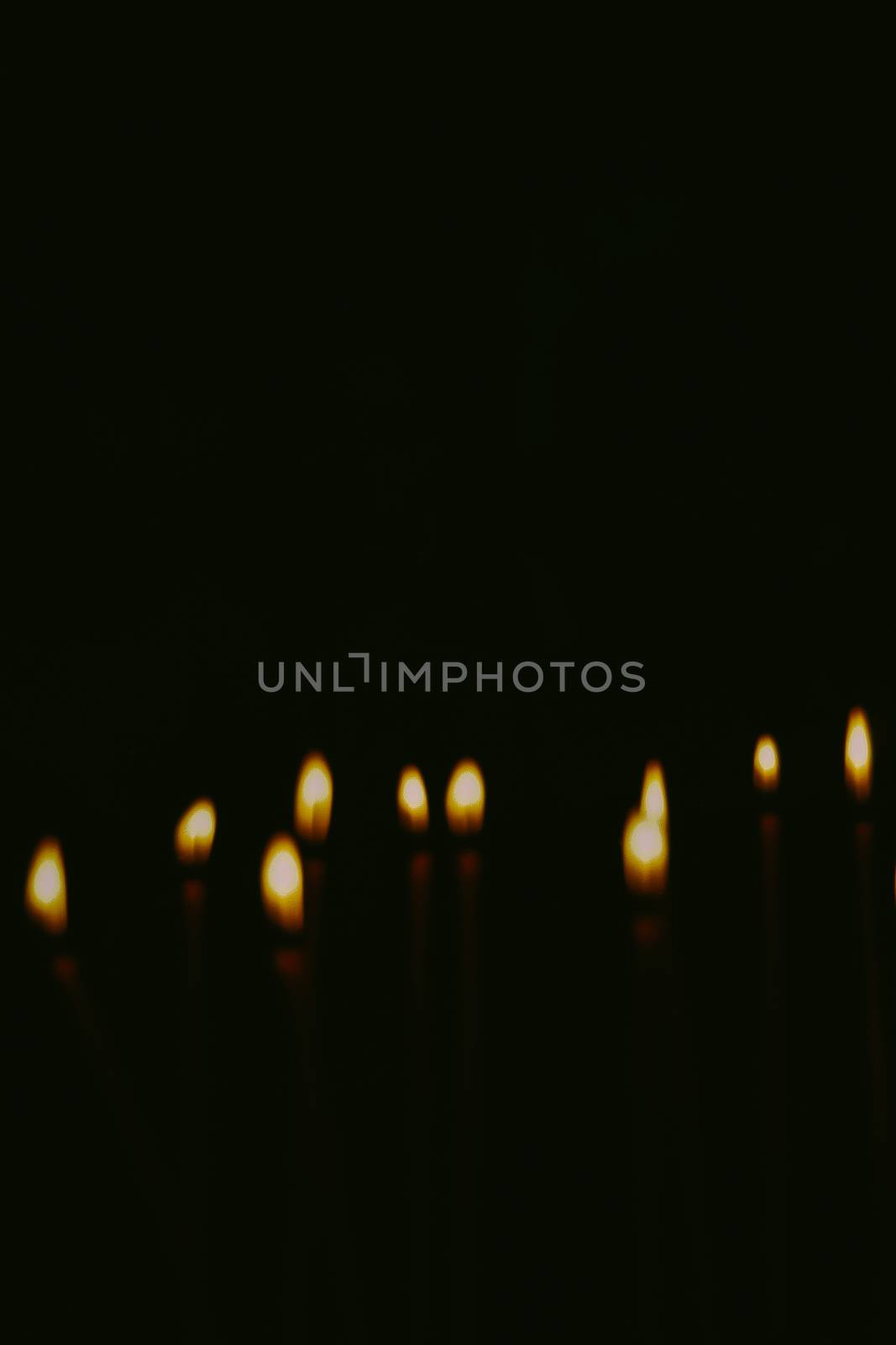 Artistic abstract blur background with church candles