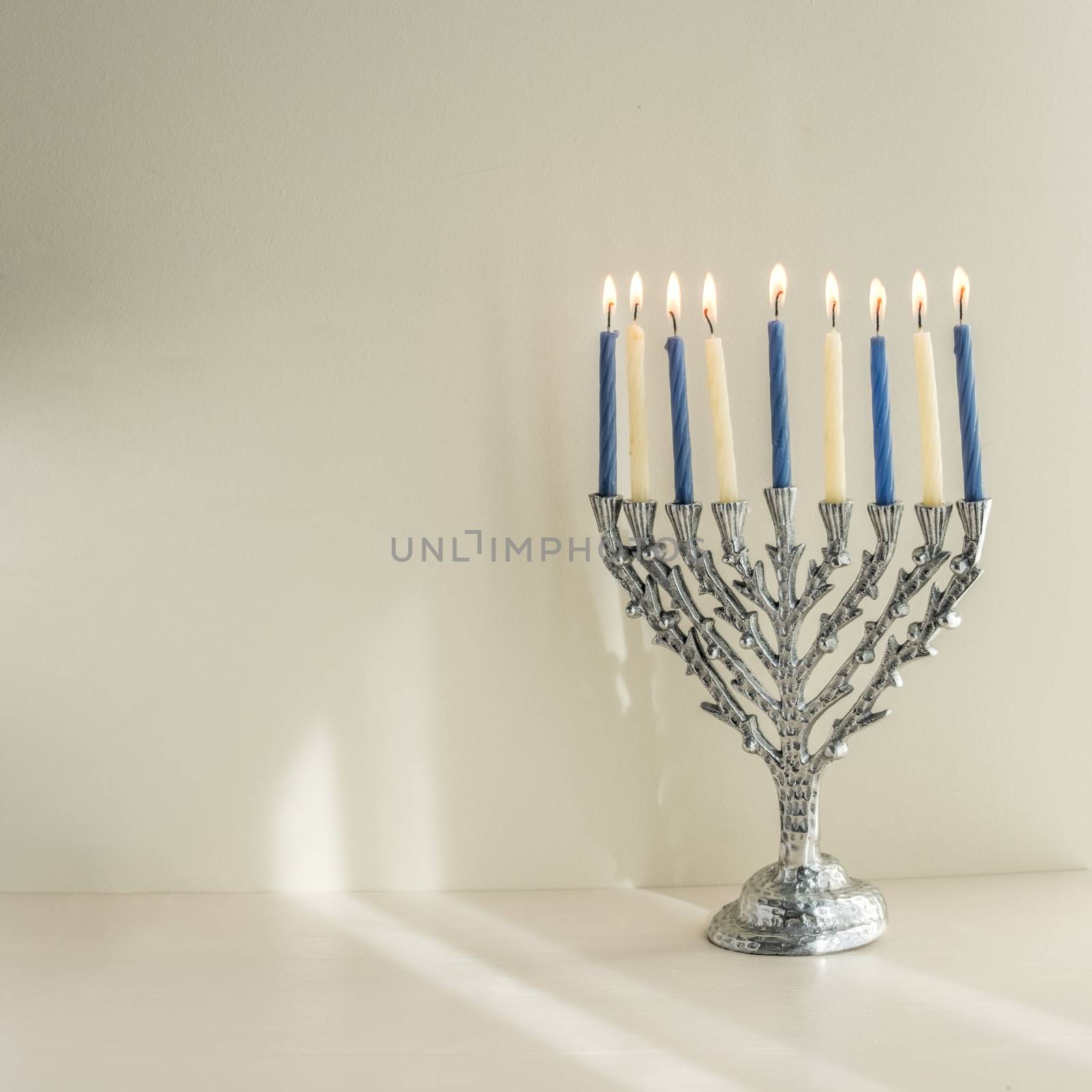 The Symbols of Hanukkah - nine-branched mehorah Hanukiah