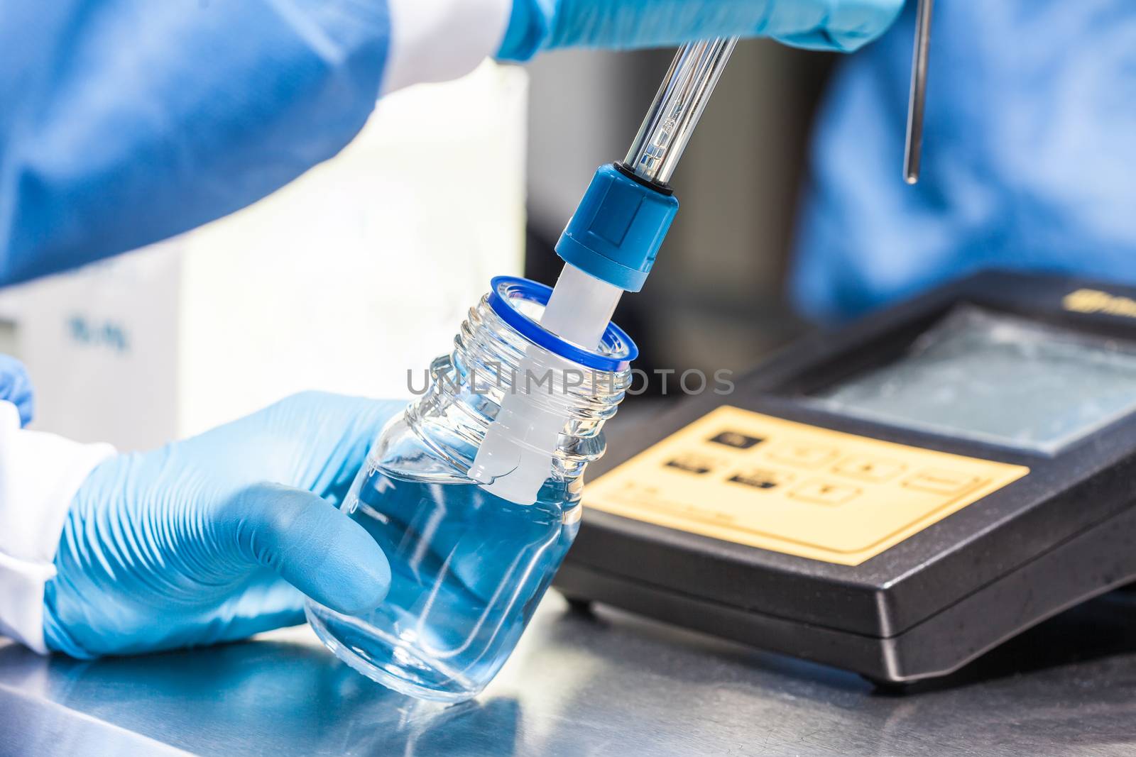 Scientist using a ph meter at laboratory