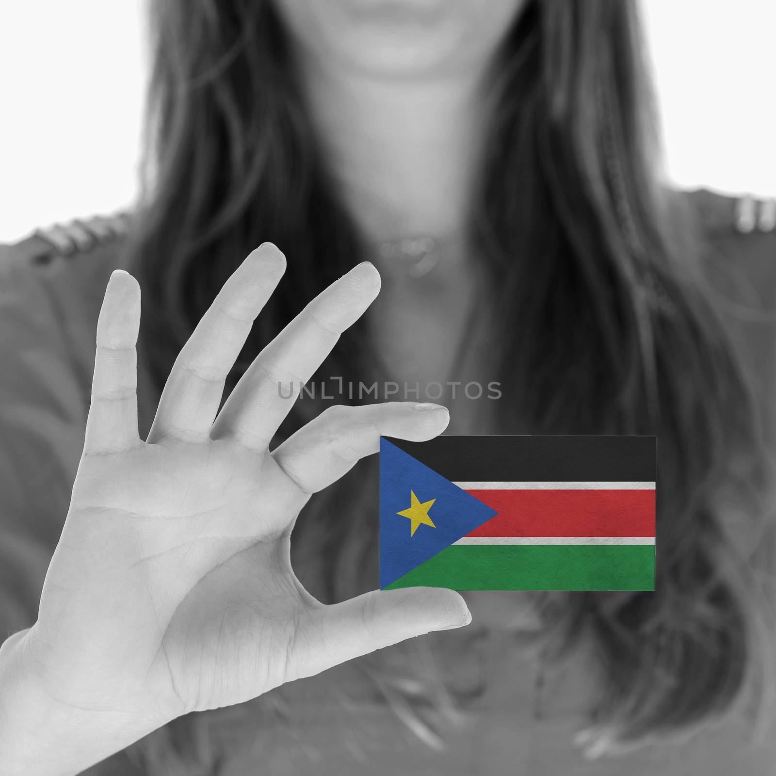 Woman showing a business card - South Sudan by michaklootwijk