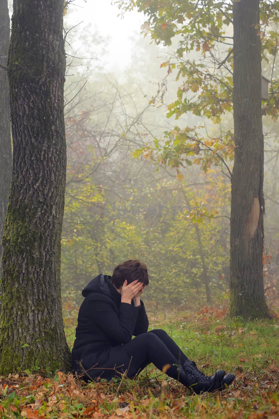 woman in depression in forest by mady70