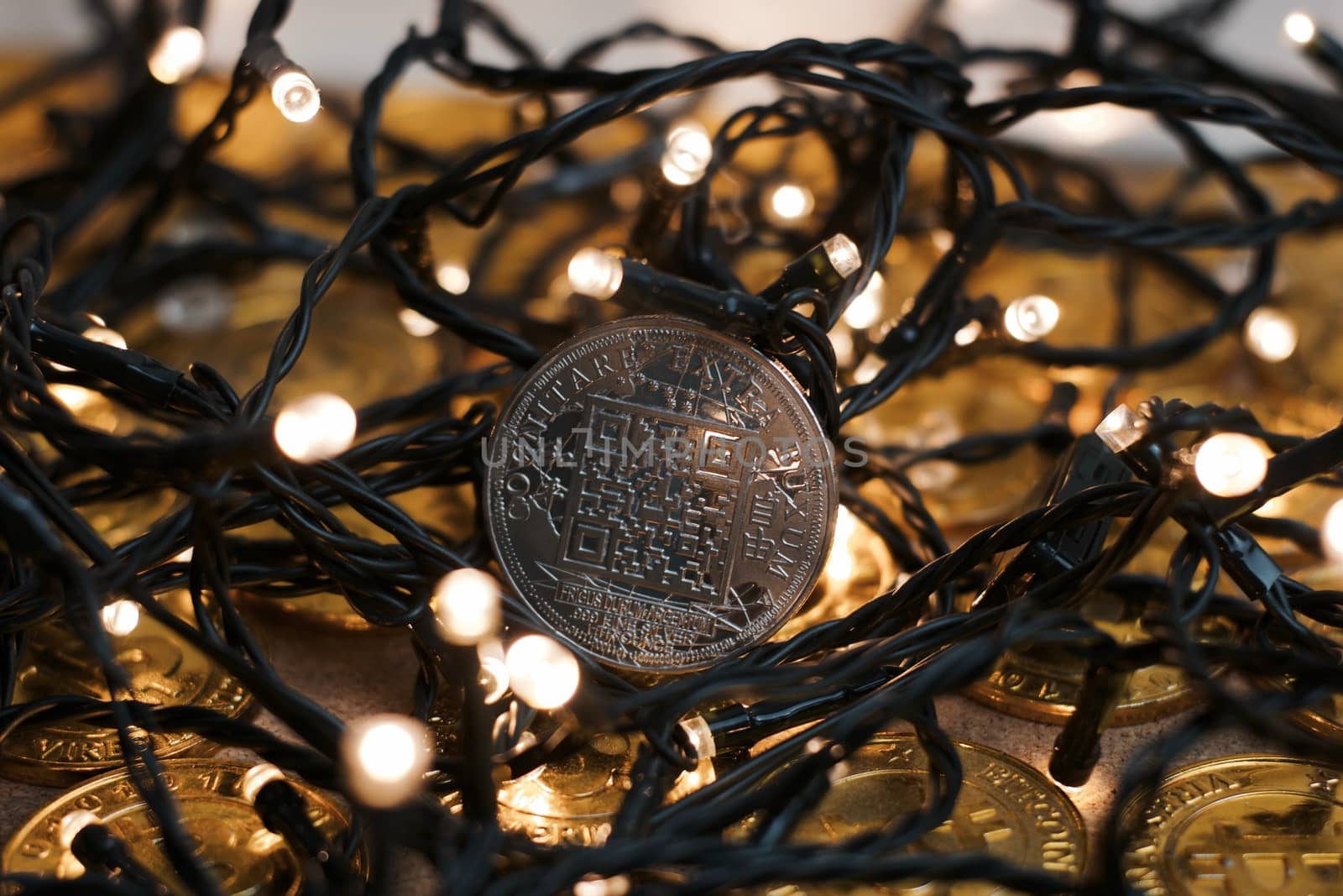 Digital currency physical metal bitcoin coin on the christmas concept.
