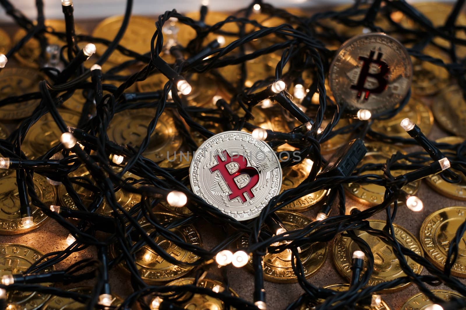 Digital currency physical metal bitcoin coin on the christmas concept.