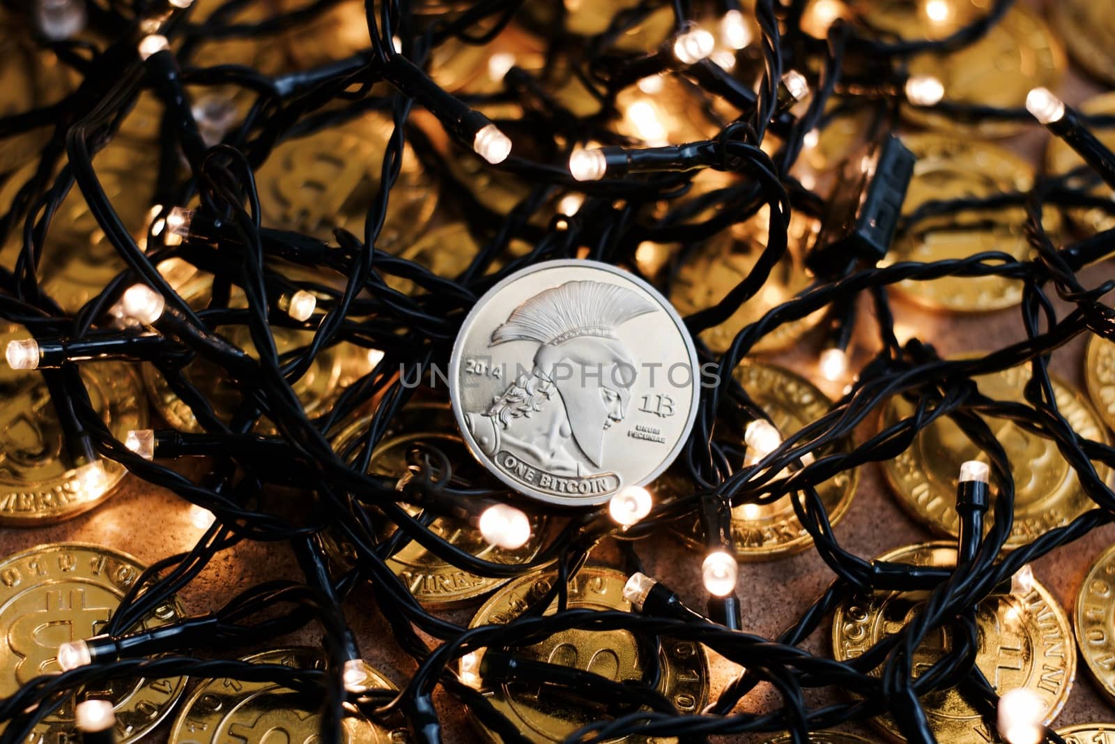 Digital currency physical metal bitcoin coin on the christmas concept.