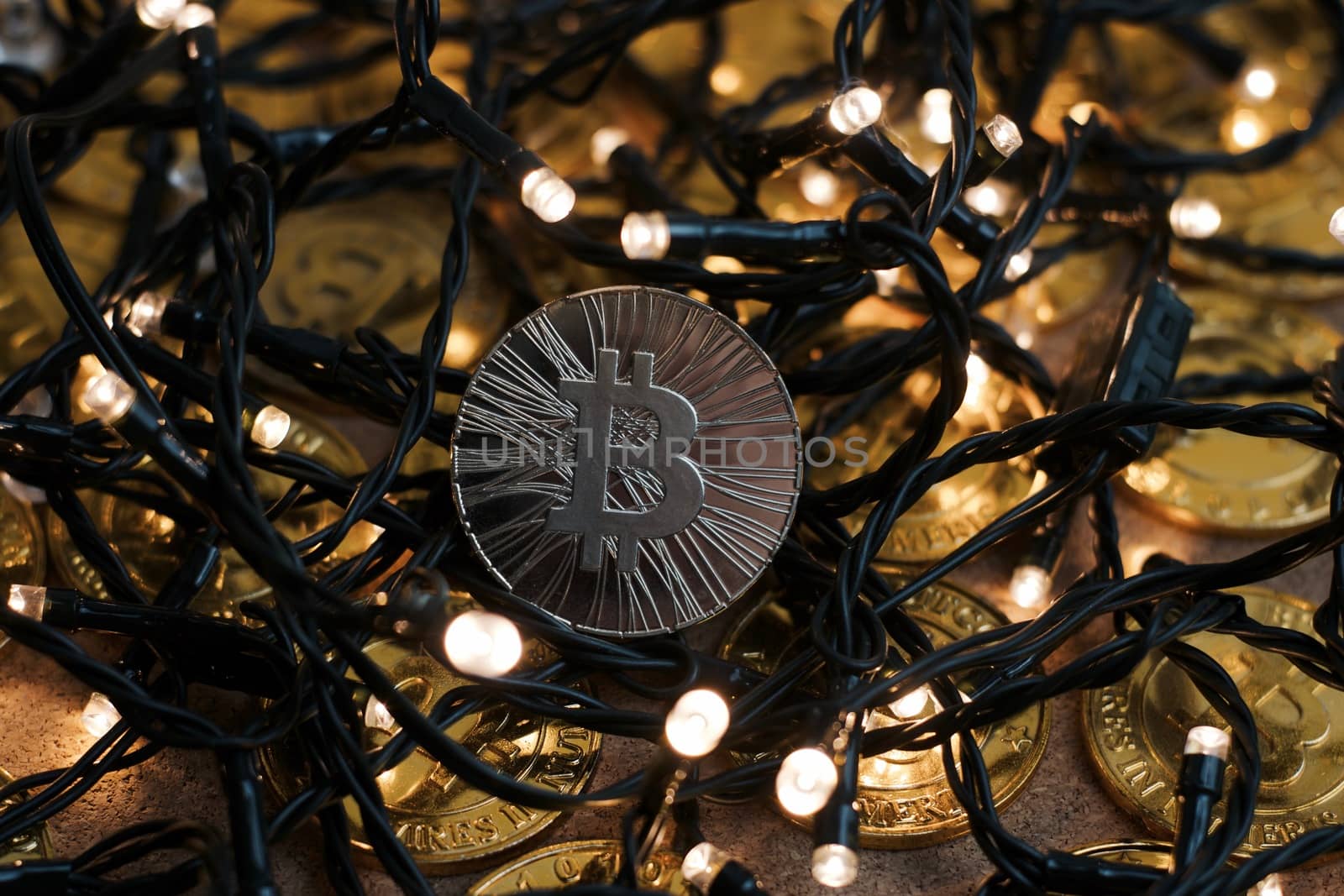 Digital currency physical metal bitcoin coin on the christmas concept.
