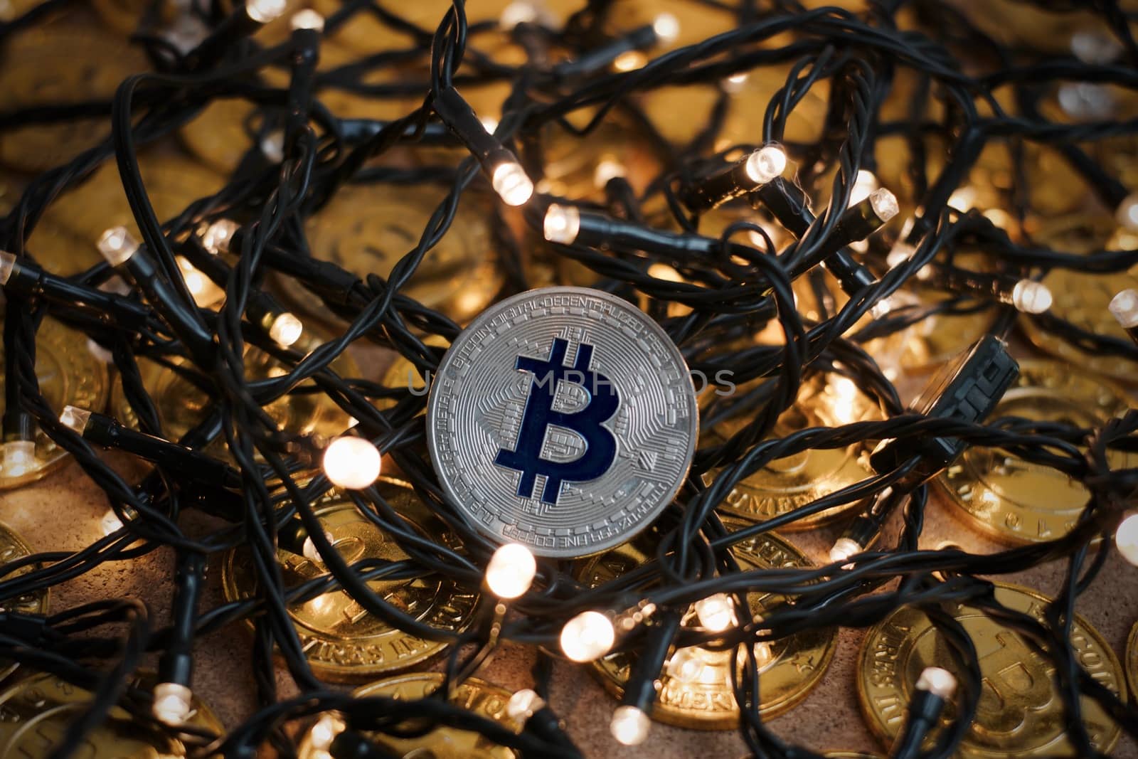 Digital currency physical metal bitcoin coin on the christmas concept.