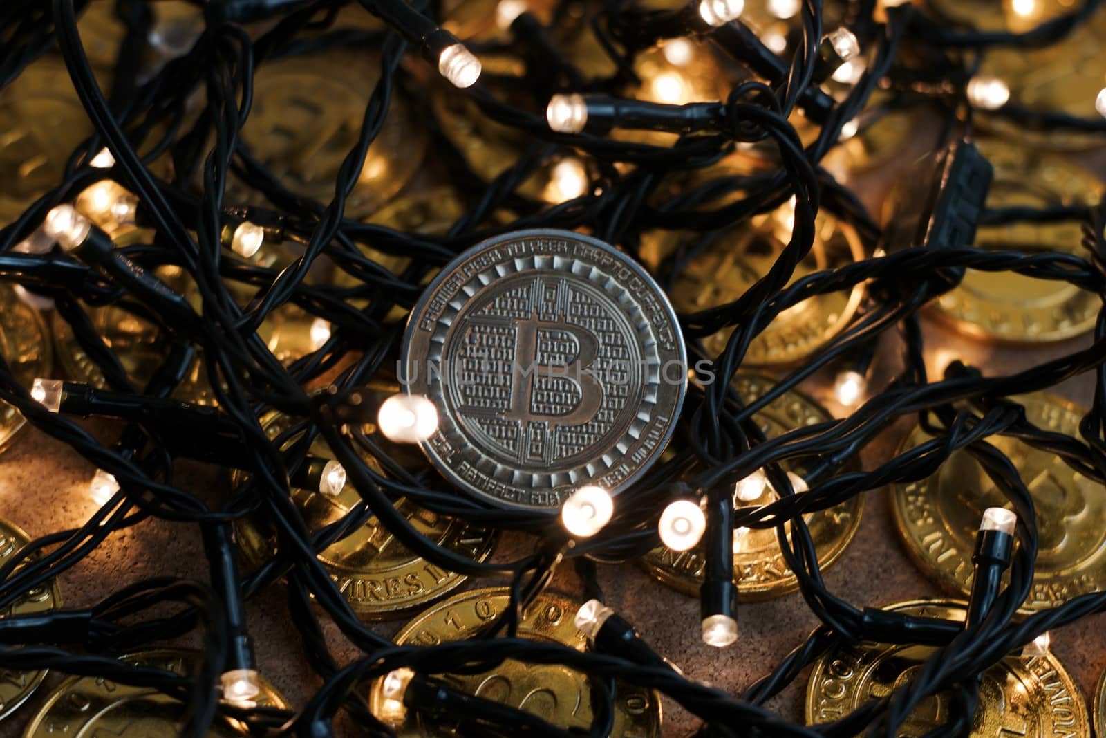 Digital currency physical metal bitcoin coin on the christmas concept.