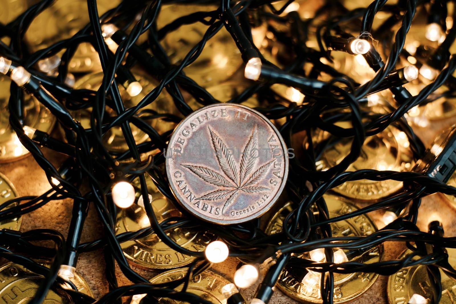 Brass physical marijuana coin. Christmas time sativa concept.