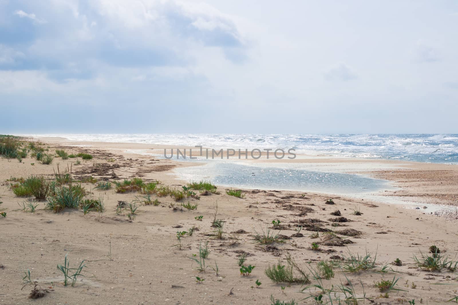 Sandy empty sea coastal seaview, cloudy colourful sunrise sky view