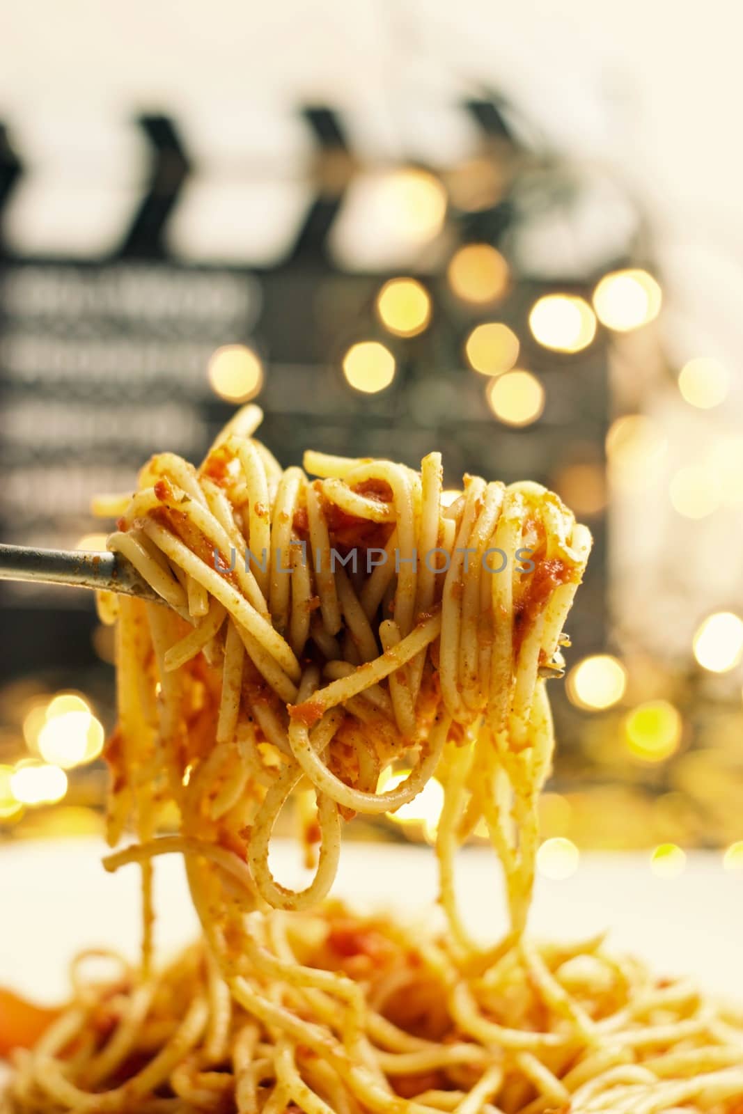 Italian tasty pasta with tomatoes on a silver fork. Christmas concept.