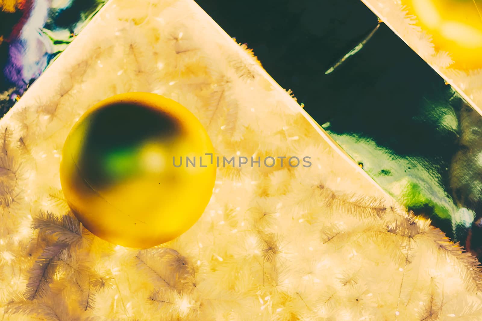 Yellow christmas ornaments on tree