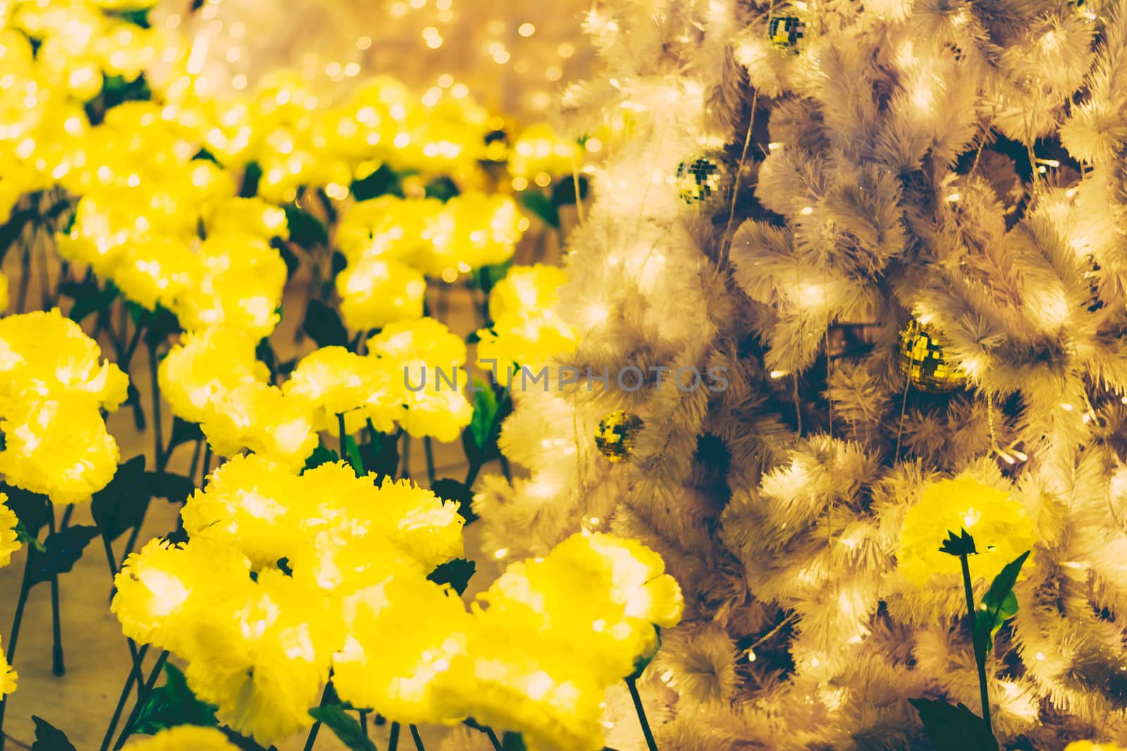 Yellow christmas ornaments on tree