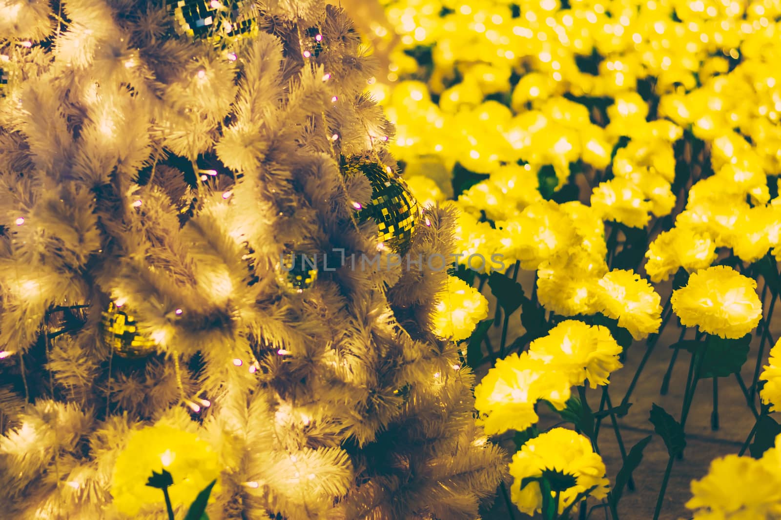 Yellow christmas ornaments on tree