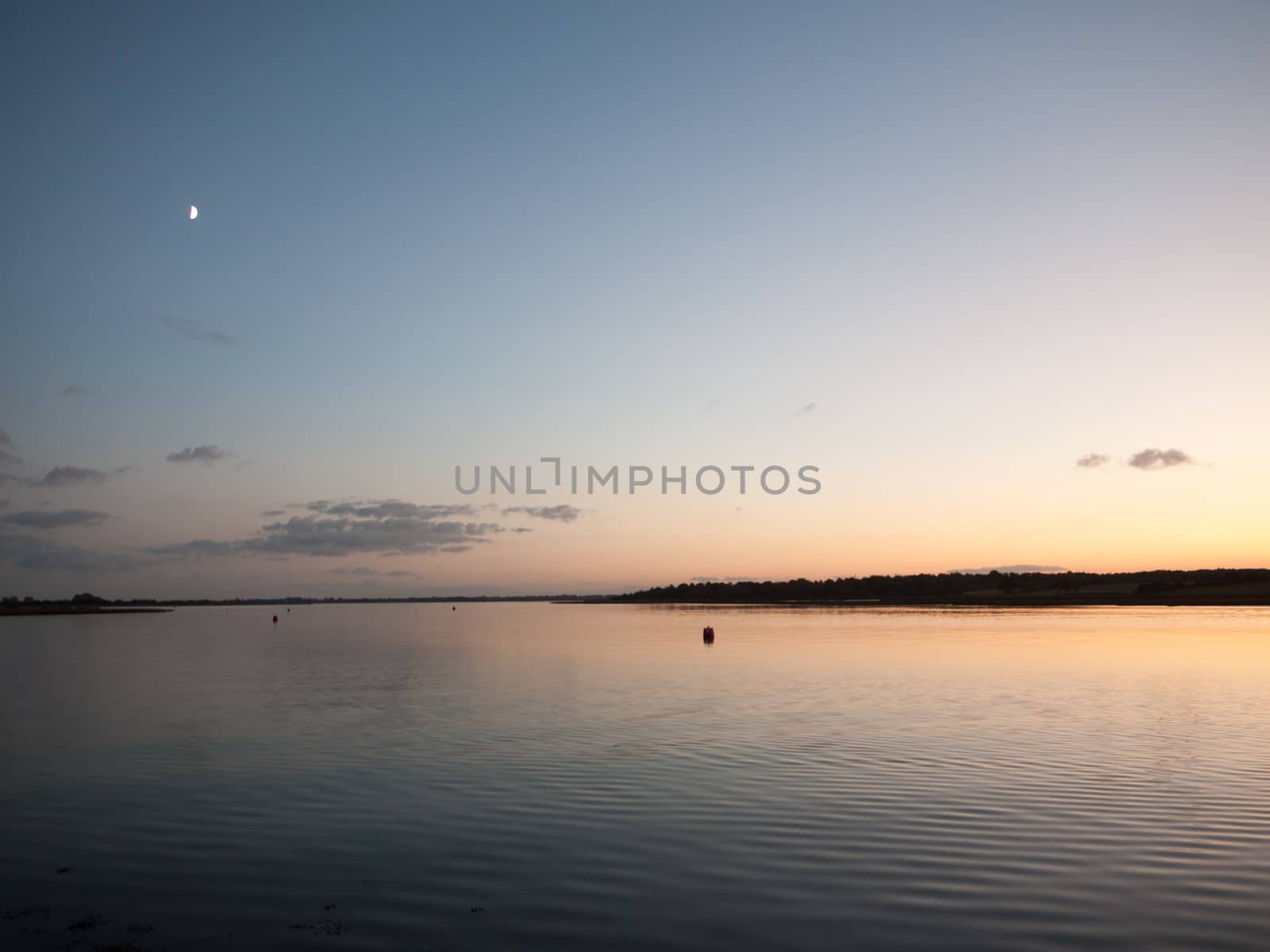 beautiful sunset evening bay scene open space water surface waves; essex; england; uk