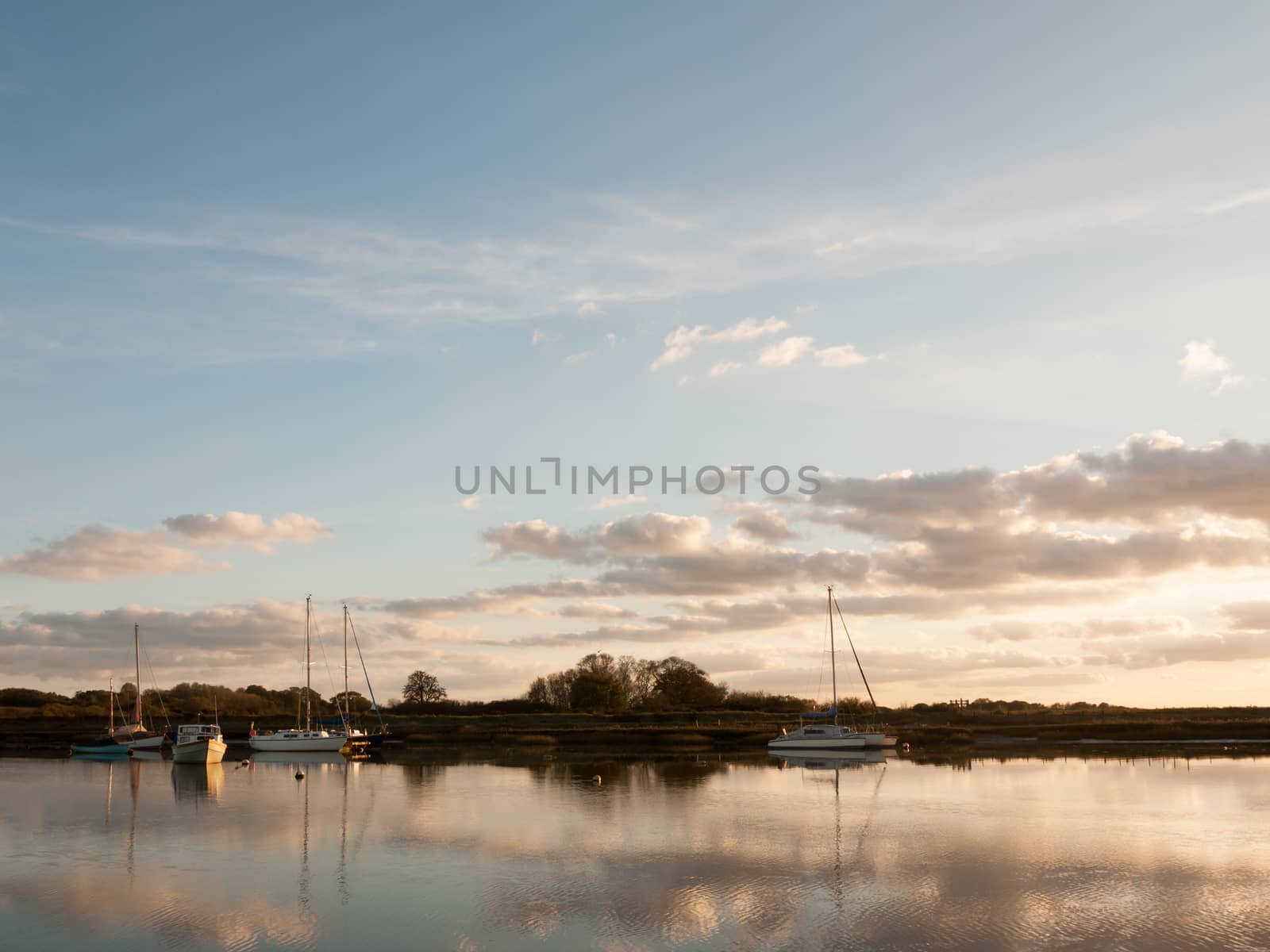 boats parked on river harbour water landscape; essex; england; uk