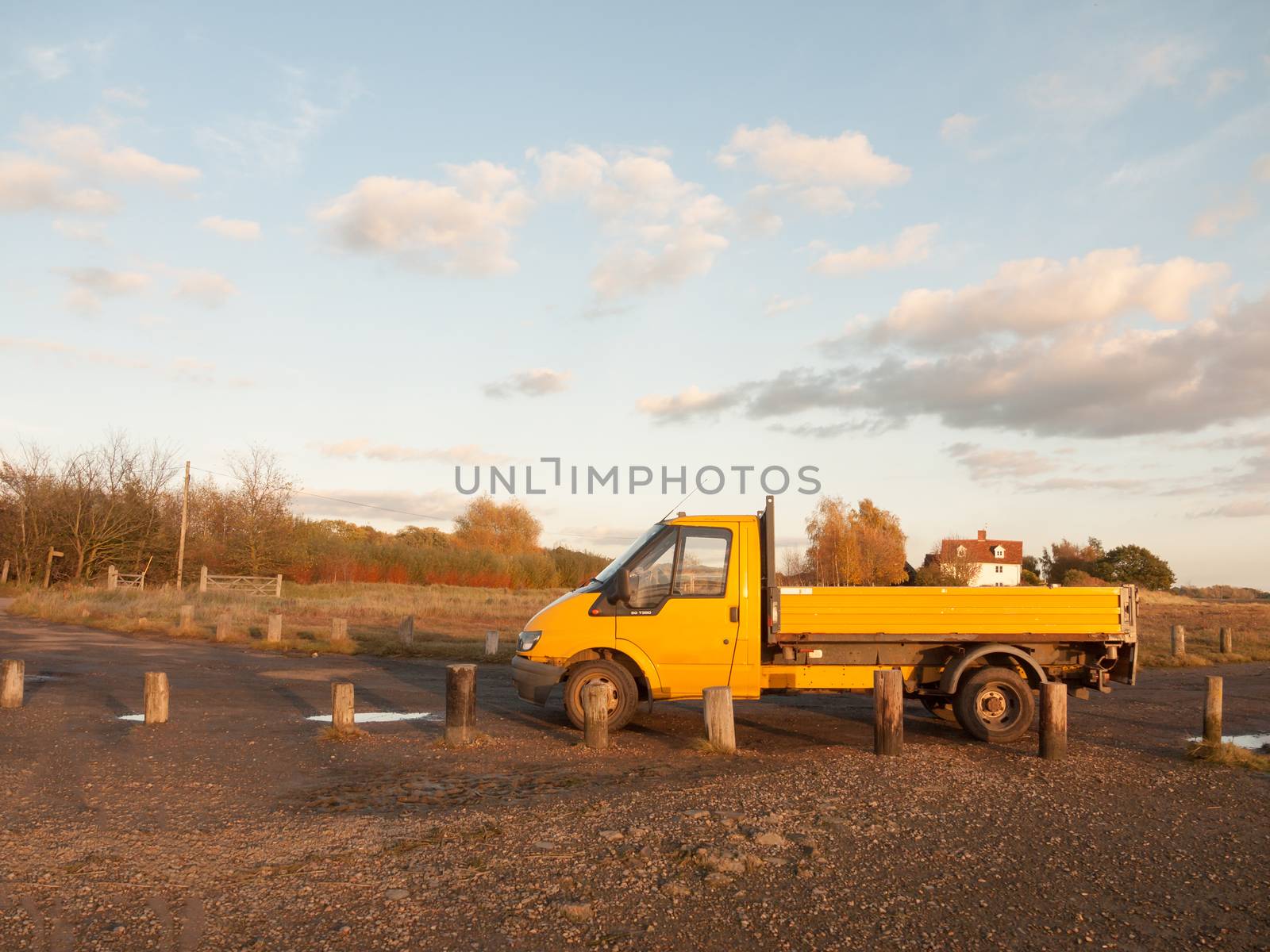 yellow outside environment van parked on gravel ranger; essex; england; uk