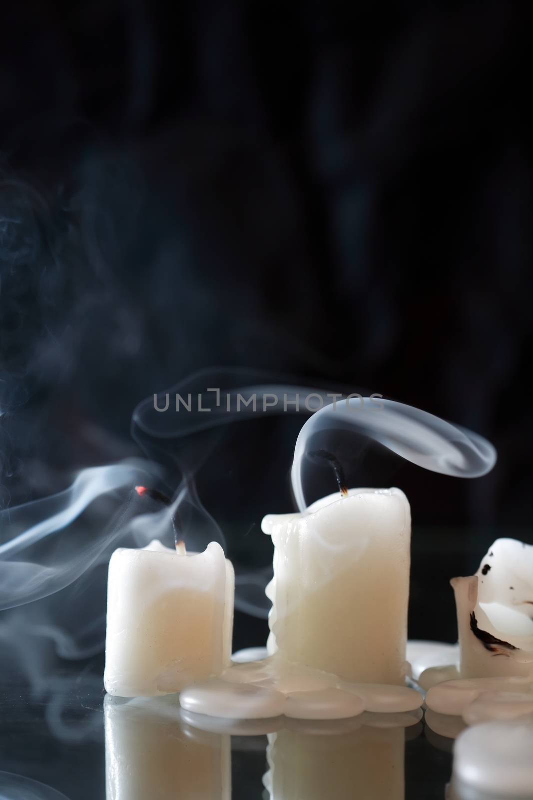 Extinguished Candles On Dark by kvkirillov