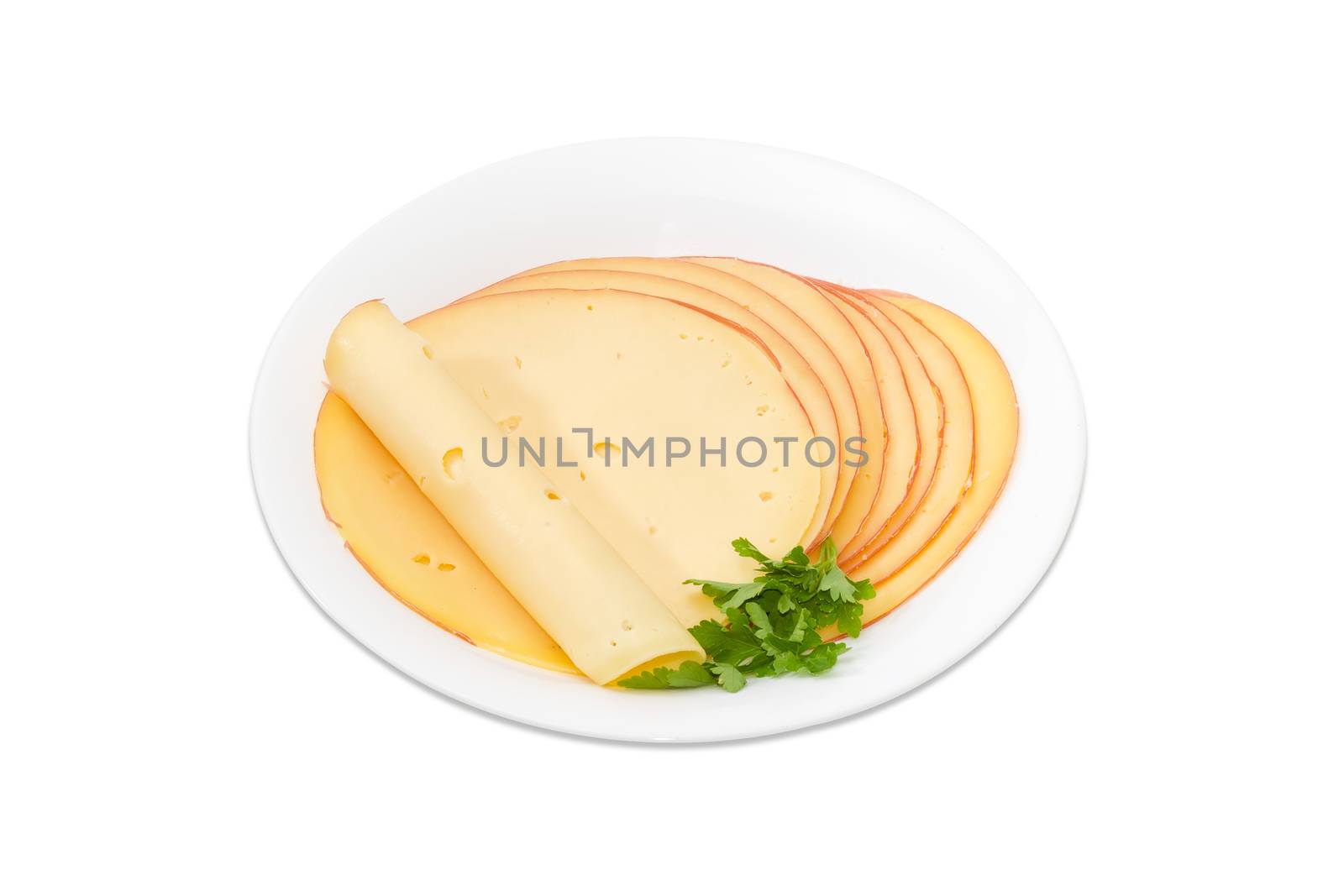 Cheese sliced into round on white dish by anmbph