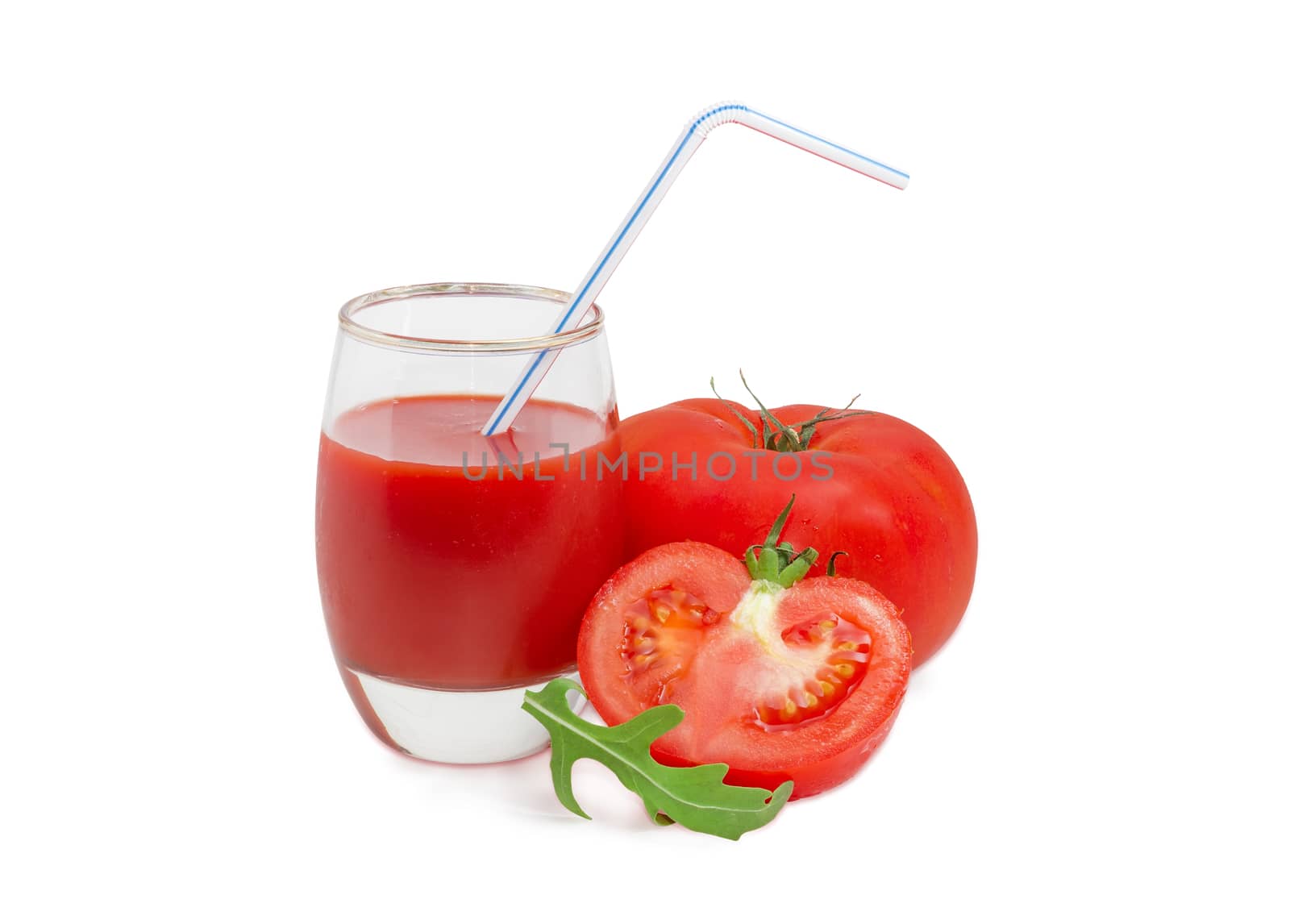 Tomato juice in glass with bendable drinking straw, one whole and one half of the fresh ripe tomatoes and arugula leaf on a light background
