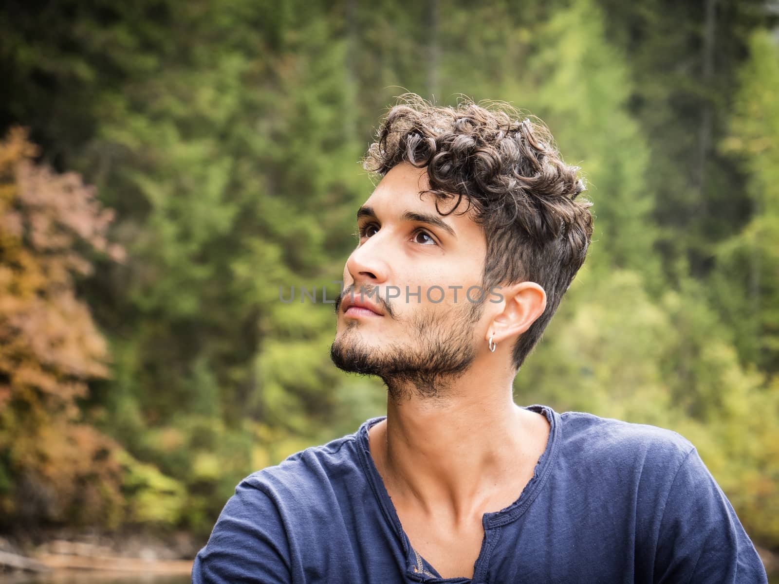 Young man relaxing in the mountain by artofphoto