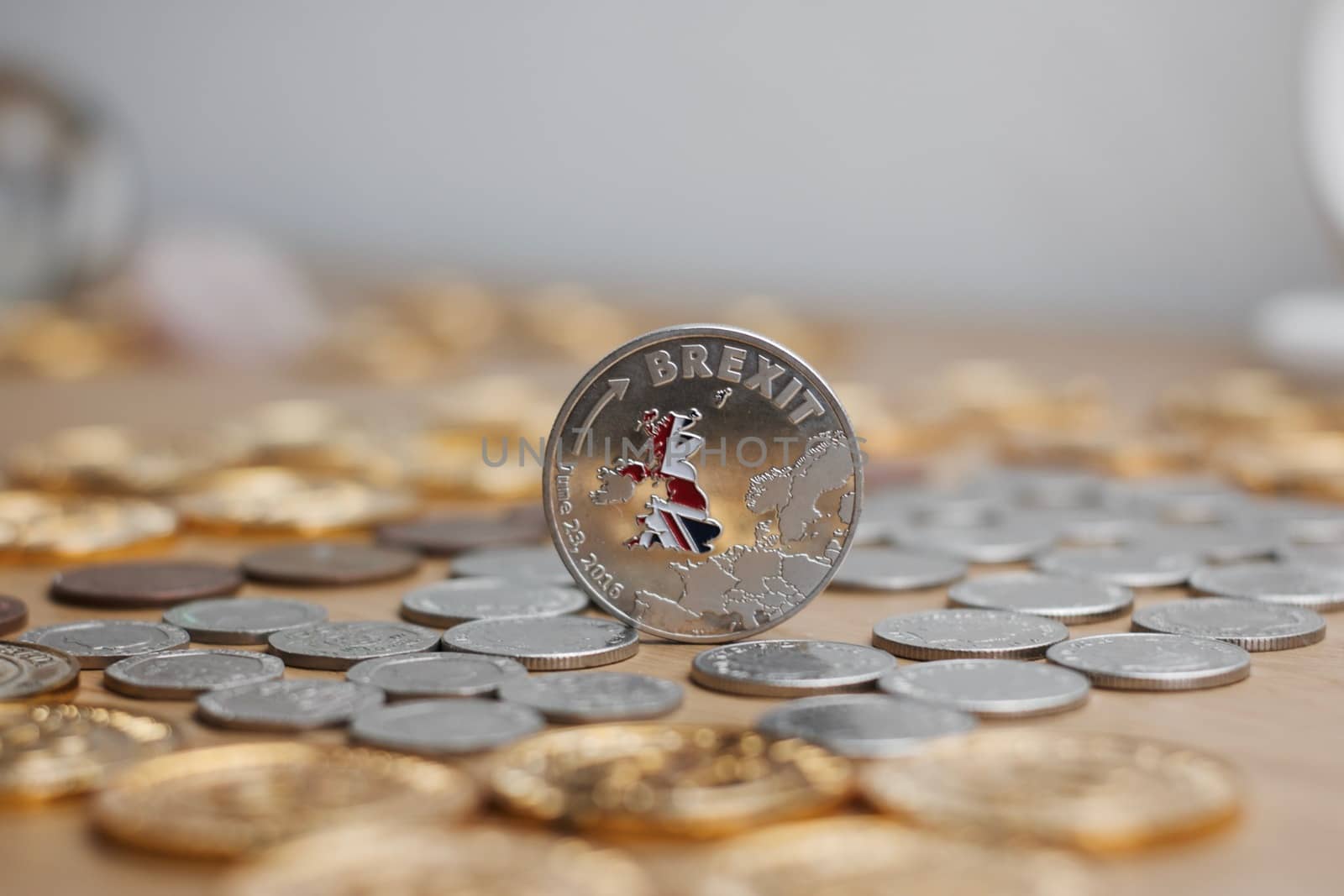 Physical metal silver brexit coin with British map on the front. Europe leaving. Article 50.